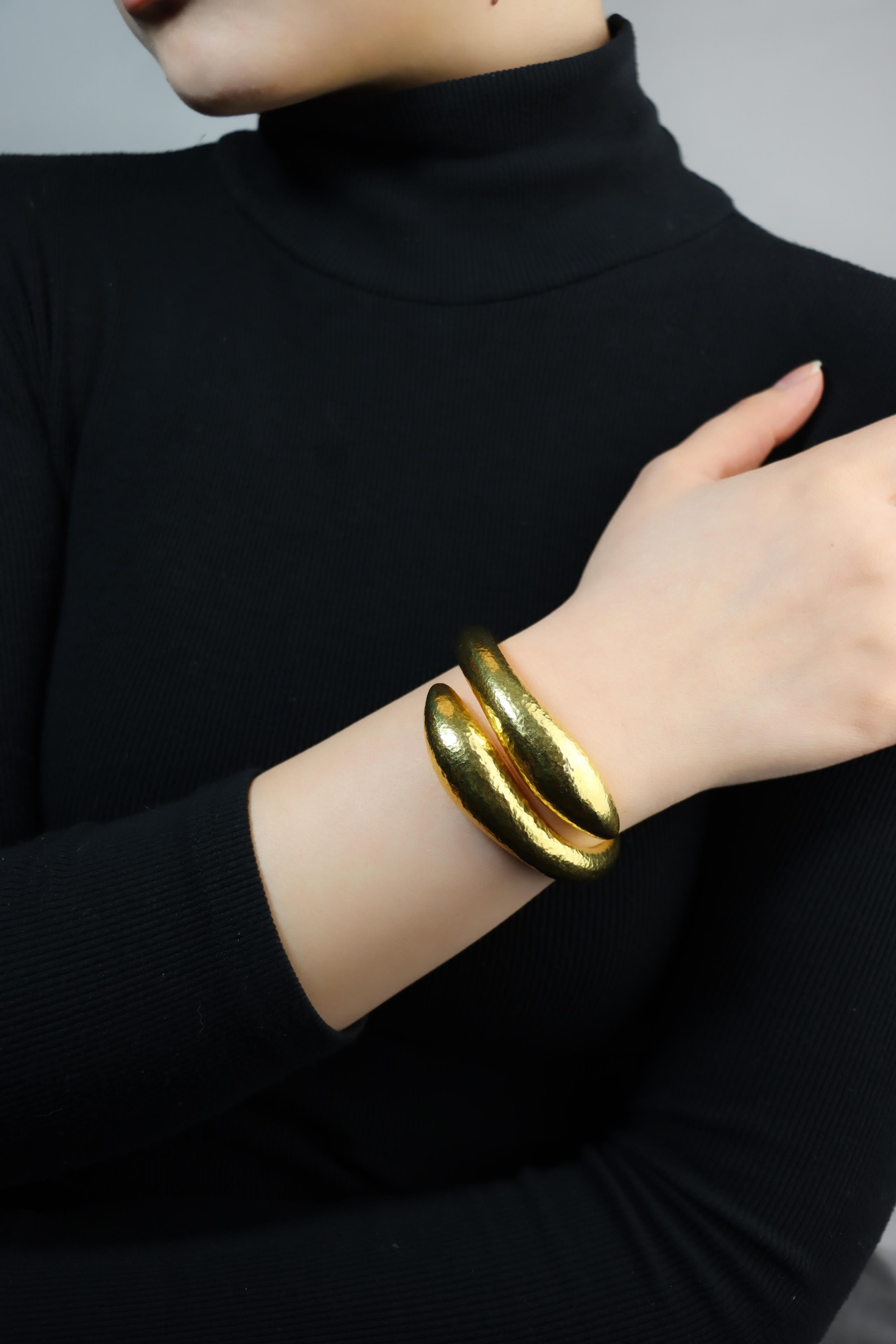 Vintage Lalaounis 18K Gold Textured Bangle Bracelet
Of sculpted gold bypass designed

Marked:
MEGAN
M
Maker's Mark
Greece
 750

Approximate Dimensions:
16 cm (Length) 
0.8 - 3 cm (Width)
47.3 grams in weight.
