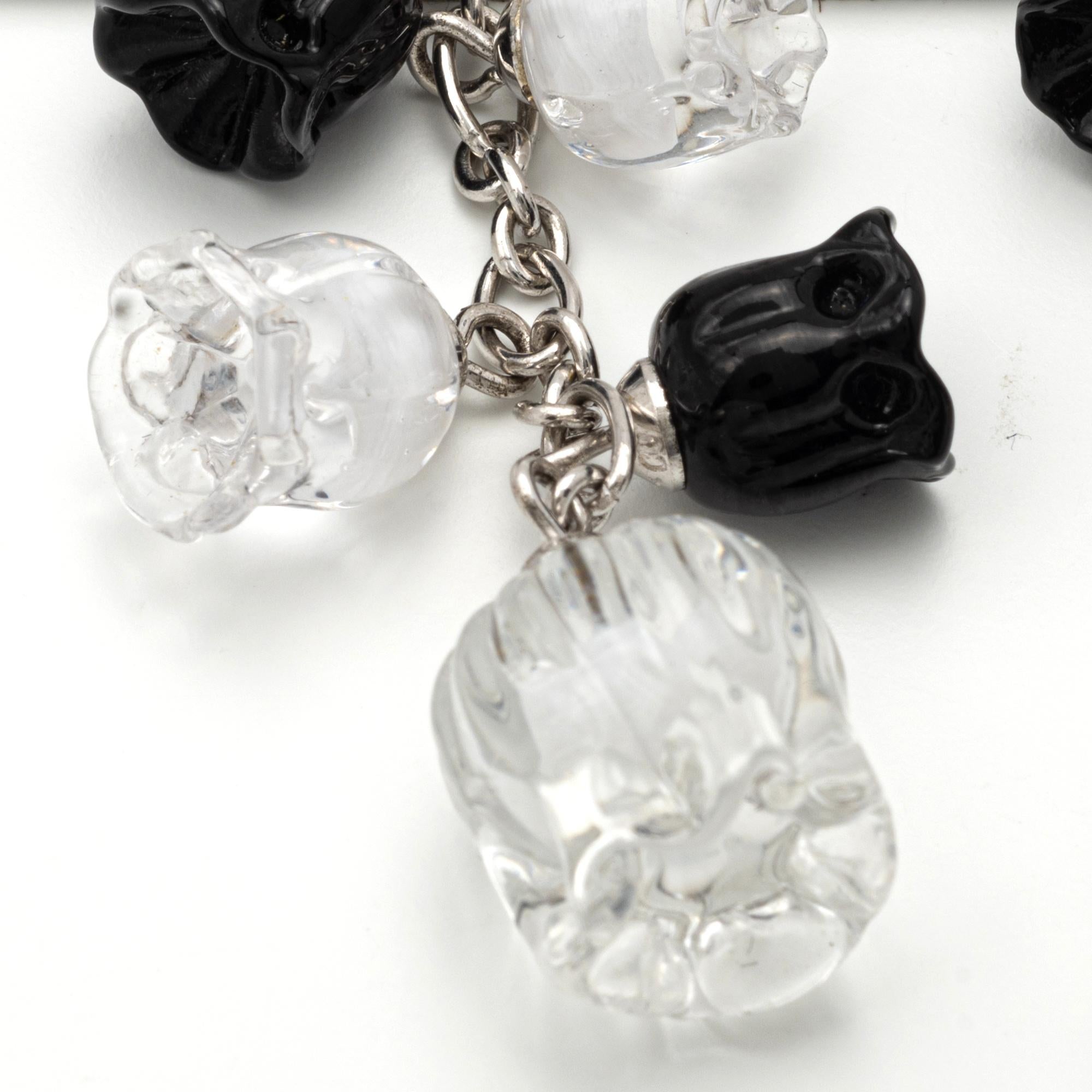 Vintage Lalique Black and White Crystal and Silver Earrings
Featuring black and white blooming crystal beads, 2 1/4 inches, signed Lalique.
