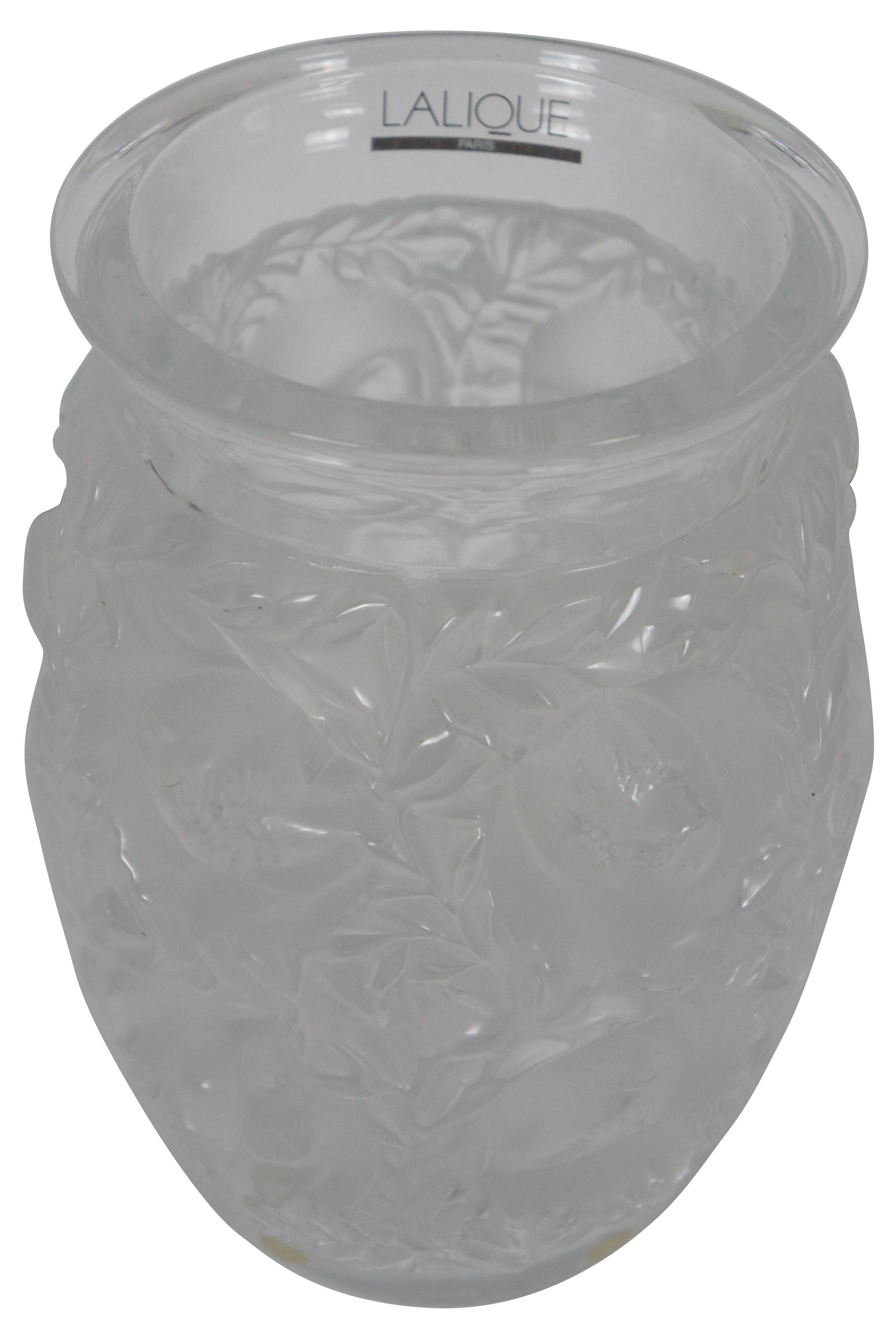 Vintage Lalique France Bagatelle frosted crystal vase featuring molded birds nestled among leaves and foliage.