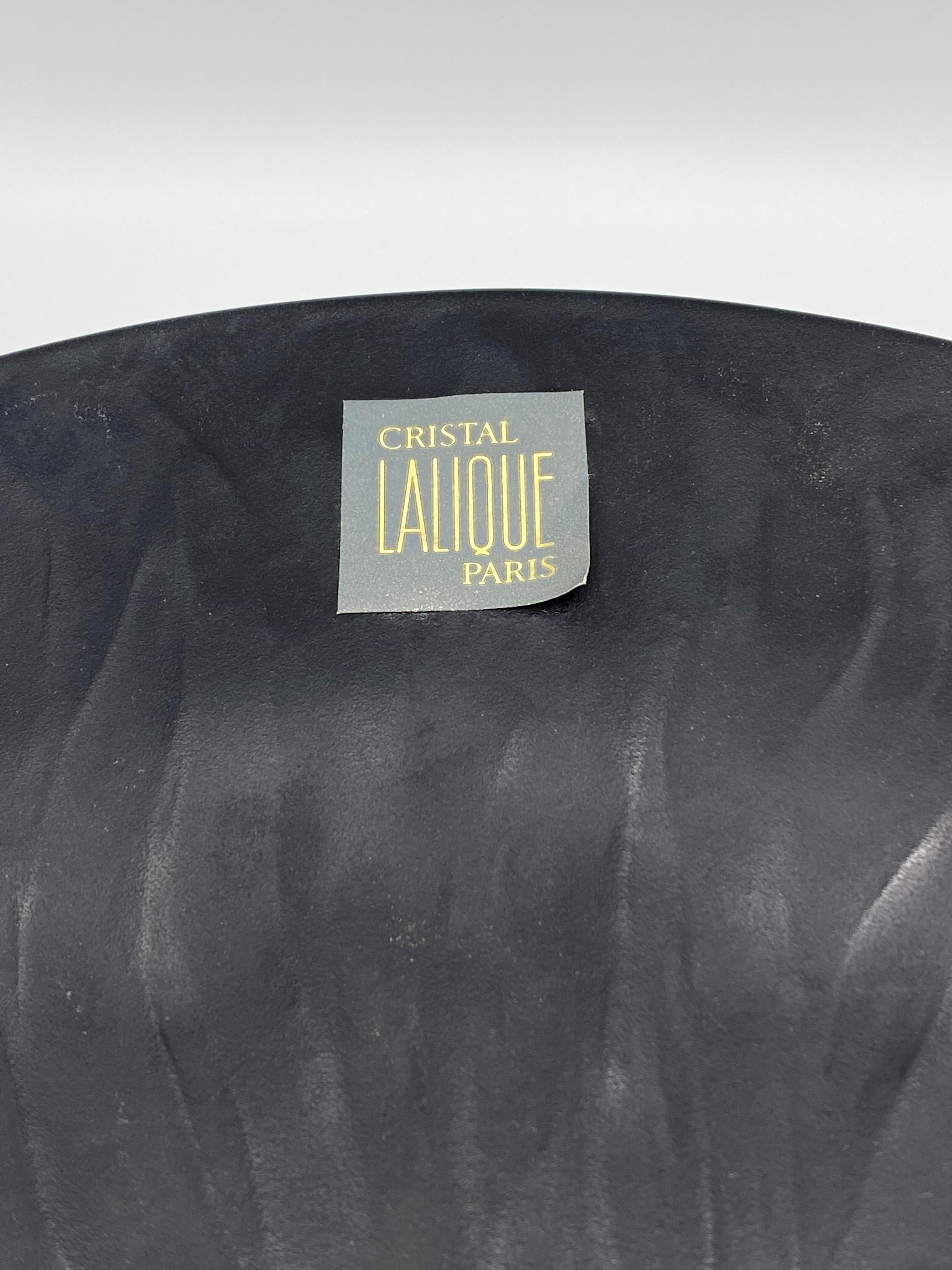 Product details:

The plates feature black crystal with matte and tree of life textured finish. It could be decorative or used as dinner plates. Each plate is signed Lalique France on the back. The plates can be sold separately upon request.
The