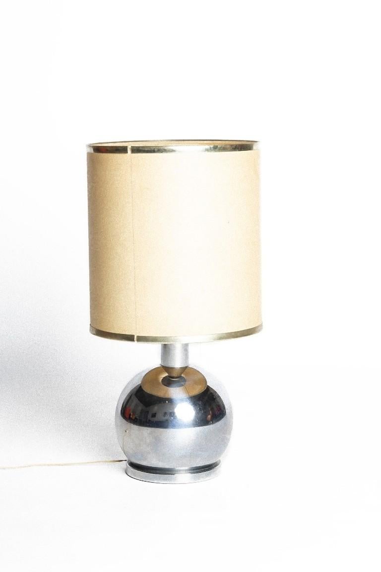 This vintage lamp is a beautiful decorative object designed by an Italian manufacturer and realized during the 1970s.

Table lamp with a chrome base and parchment type shade.

Dimensions: cm 70 x 40 (diameter).

In good conditions.

This