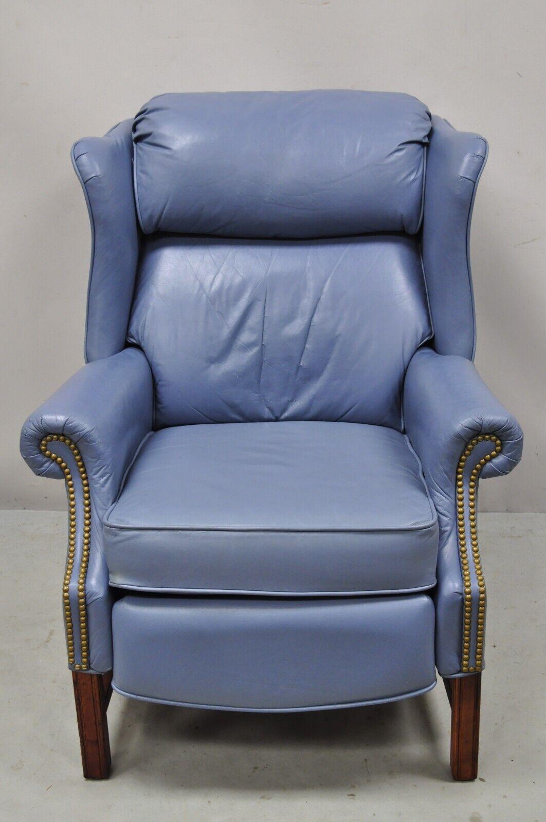 Vintage lane action blue leather wingback recliner reclining lounge chair. Item features a reclining frame, solid wood base, nail head trim, blue leather upholstery, quality American craftsmanship, great style and form, extremely comfortable. circa