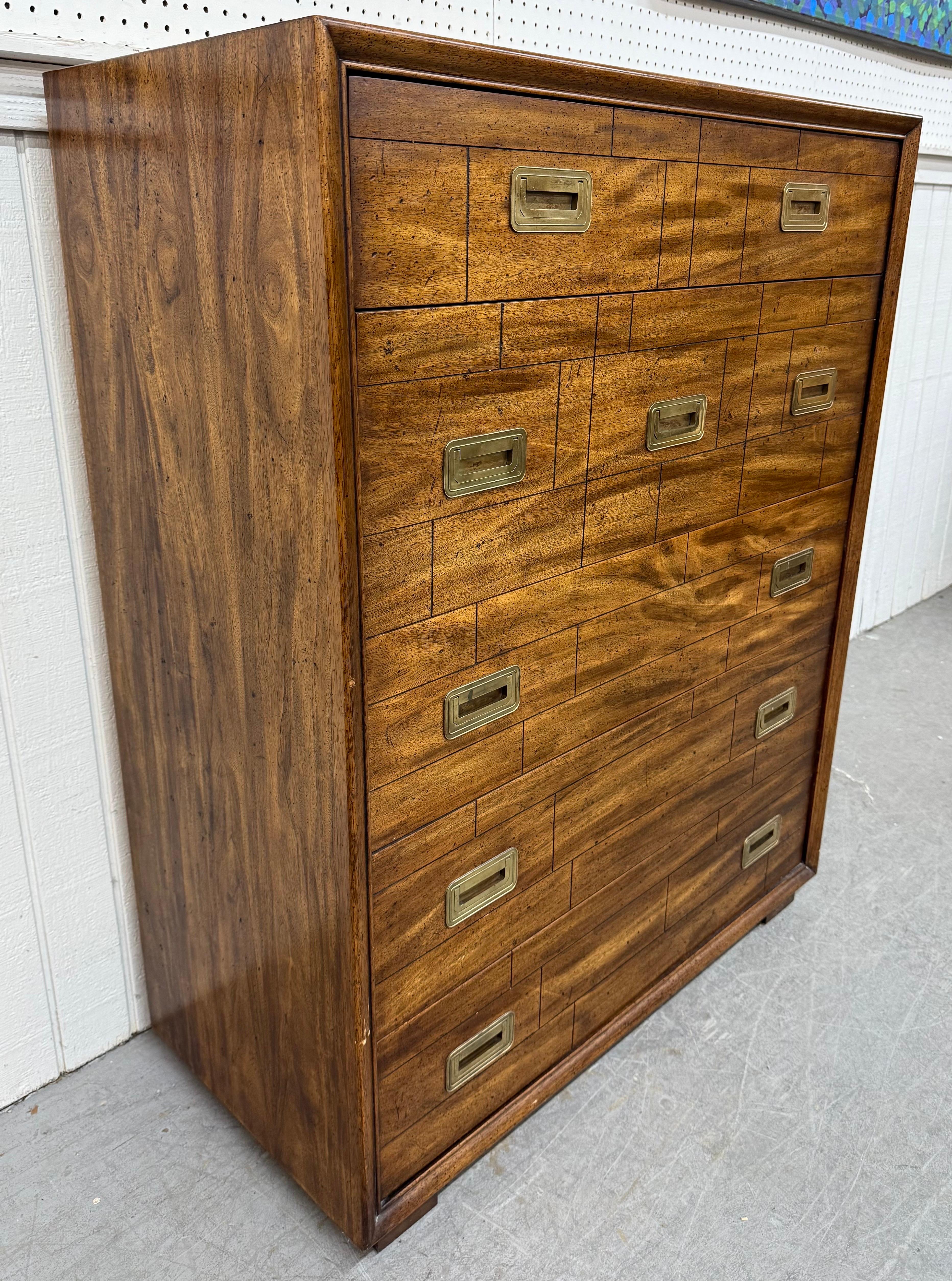 This listing is for a Vintage Lane Campaign Style Walnut High Chest. Featuring a straight line design, five drawers for storage, original campaign style brass hardware, cube feet, and a beautiful walnut finish. This is an exceptional combination of