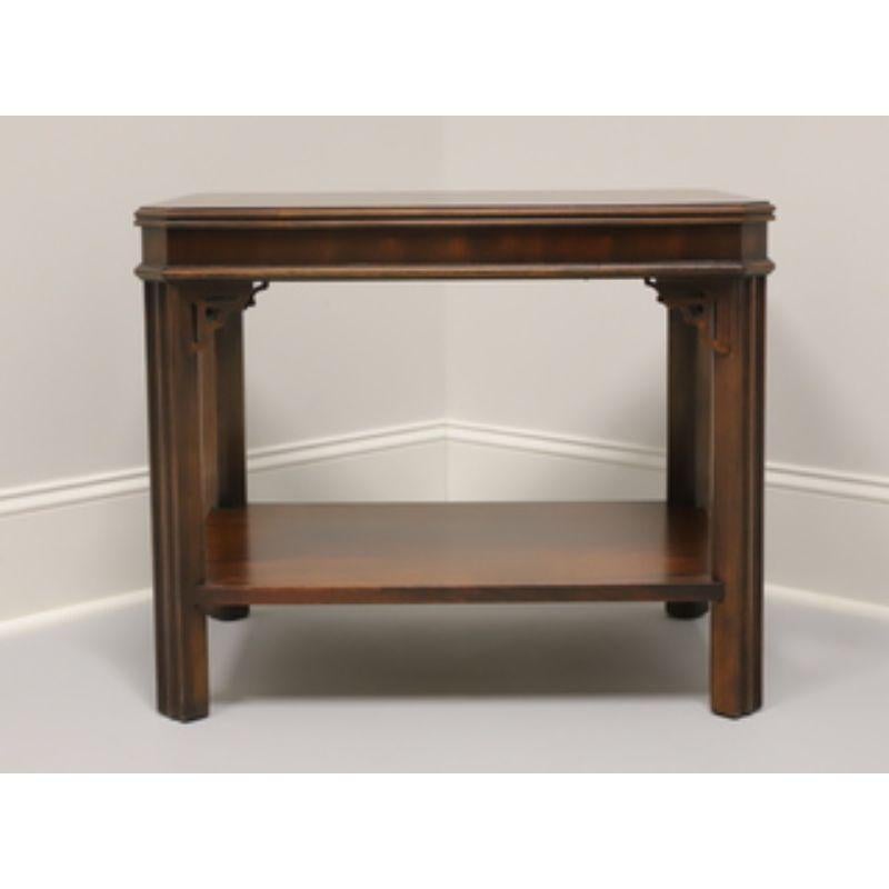 A Chippendale style end table by Lane of Altavista, Virginia, USA. Mahogany with inlaid top, fretwork accents and a lower shelf. Made in the mid 20th Century. 

Style #: 988 05

Measures: 27 W 20 D 22.25 H

Excellent vintage condition. Structurally