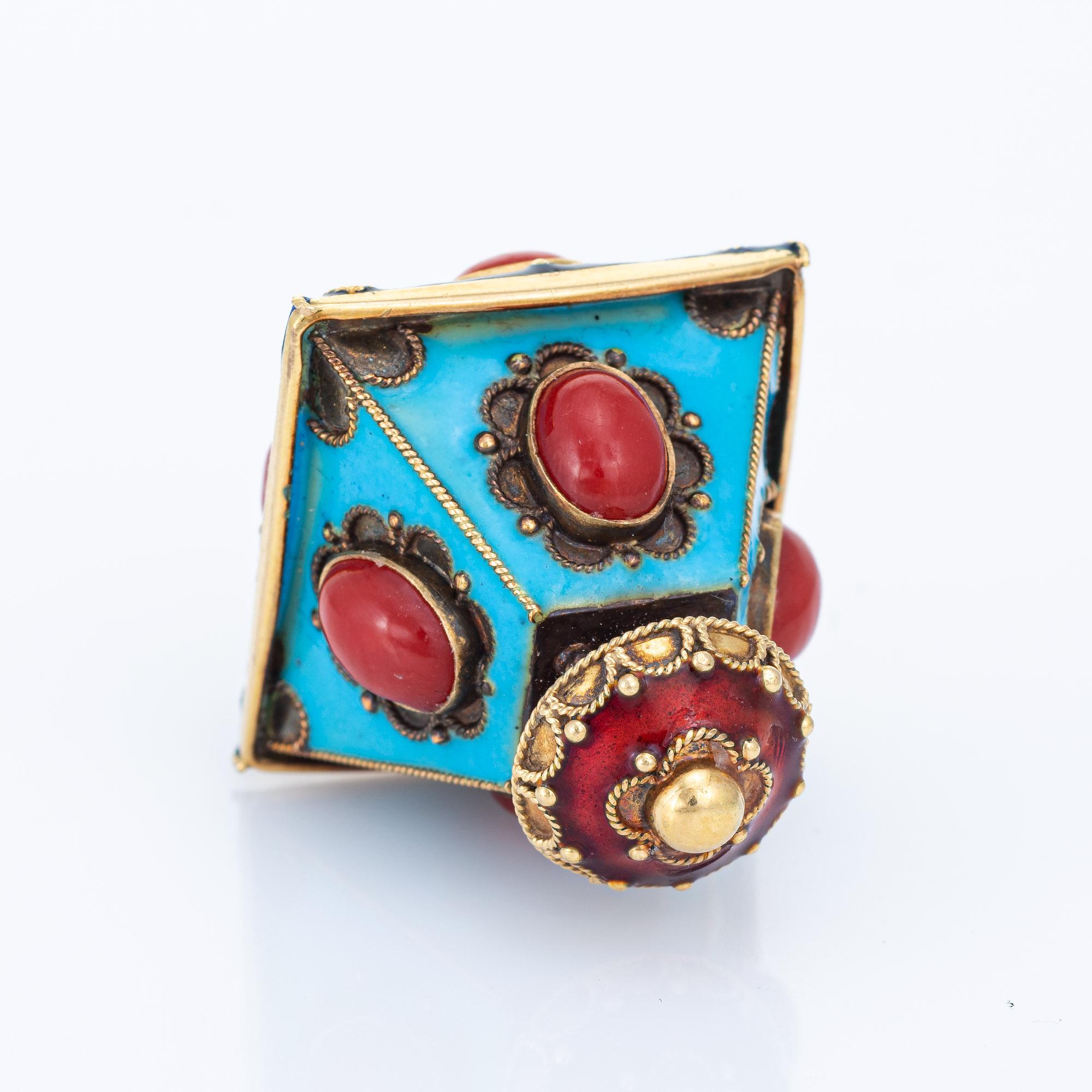 Finely detailed vintage lantern charm crafted in 18 karat yellow gold (circa 1960s). 

Eight pieces of cabochon cut Mediterranean red coral measures from 7mm x 3.5mm and 8mm x 5.5mm. The coral is in very good condition and free of cracks or