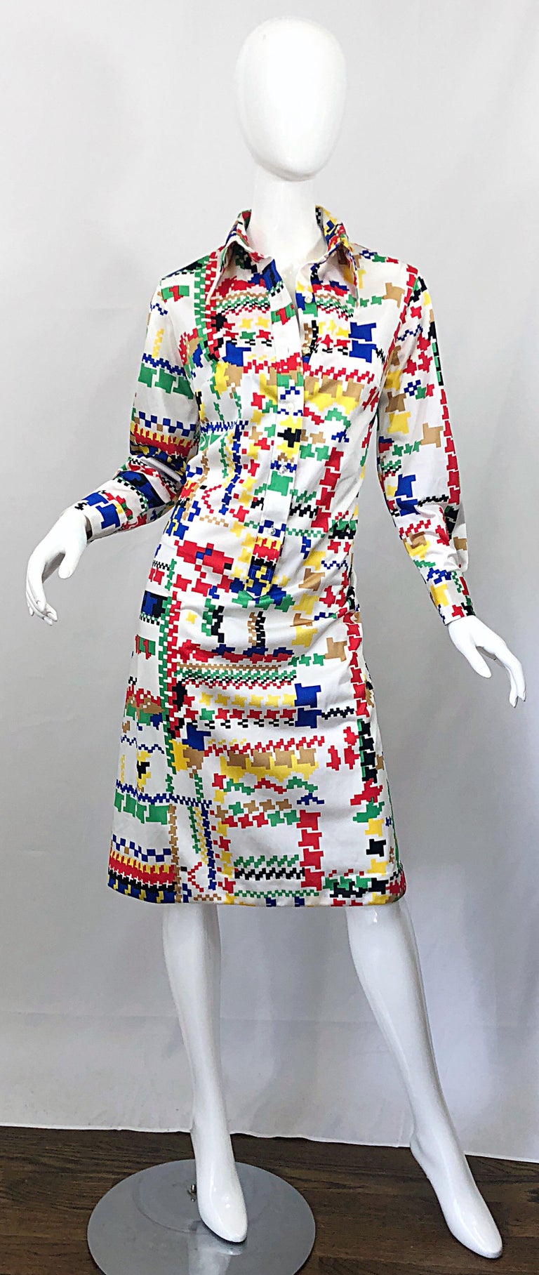 Amazing 1970s LANVIN colorful asymmetrical houndstooth print jersey shirt dress! Features signature 70s pointed collar with a sleek sheath fit with plenty of stretch. Buttons up the front and at each sleeve cuff. Vibrant colors of blue, green, red,