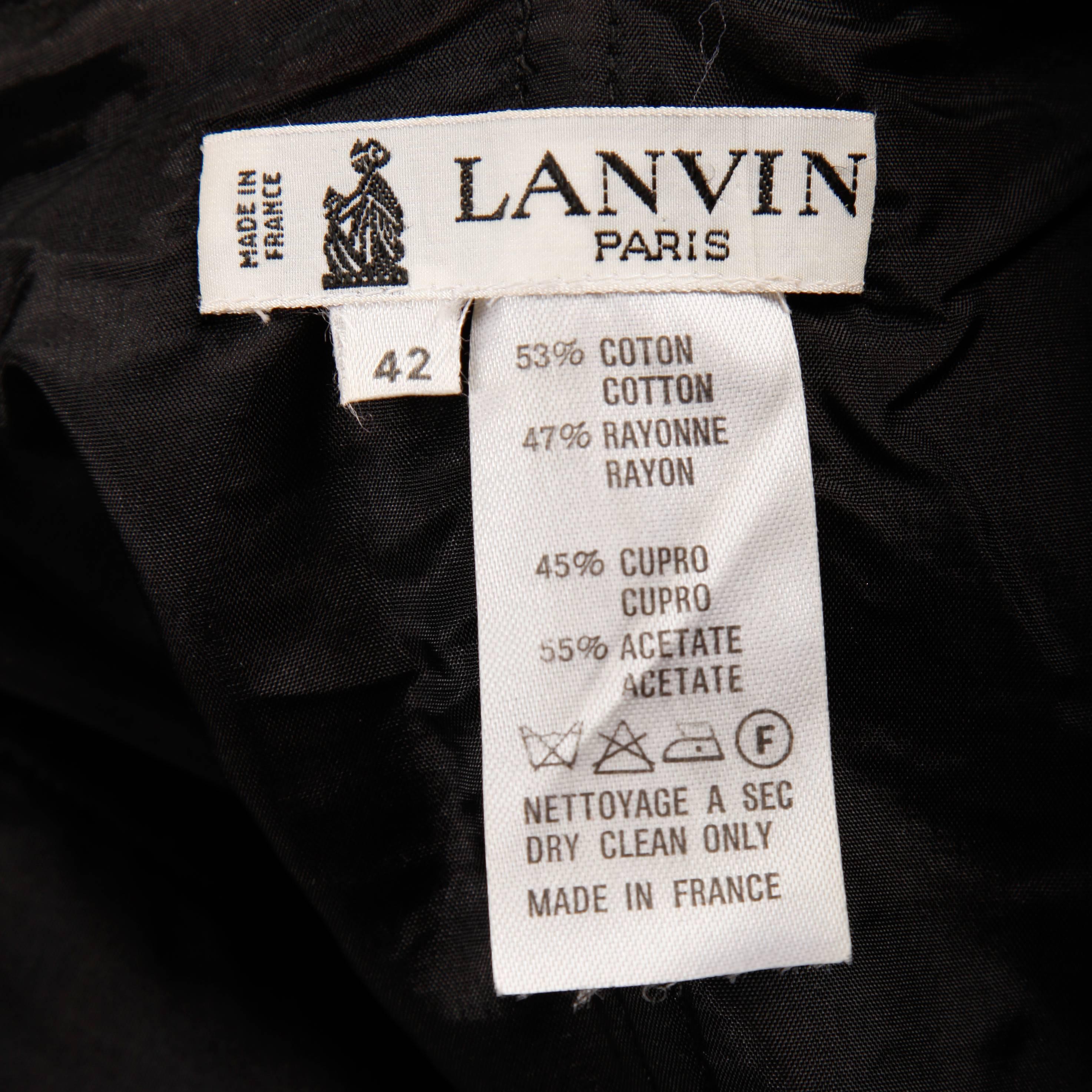 Vintage 1980s strapless moire dress by Lanvin with black velvet bows detail. Fully lined with side metal zip and hook closure. Hidden side pockets. 53% cotton, 47% rayon. The marked size is 42, but the dress fits like a modern size small. The bust