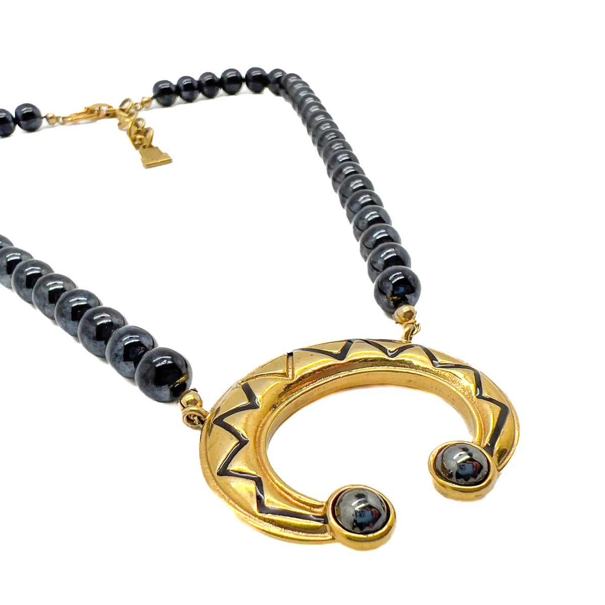 A Vintage Lanvin Crescent Necklace. Centred on a classic combination of gold and black this embellished Lanvin crescent represents all things feminine and creative. A perfect talisman from the House.
Jeanne-Marie Lanvin, 20th Century milliner turned