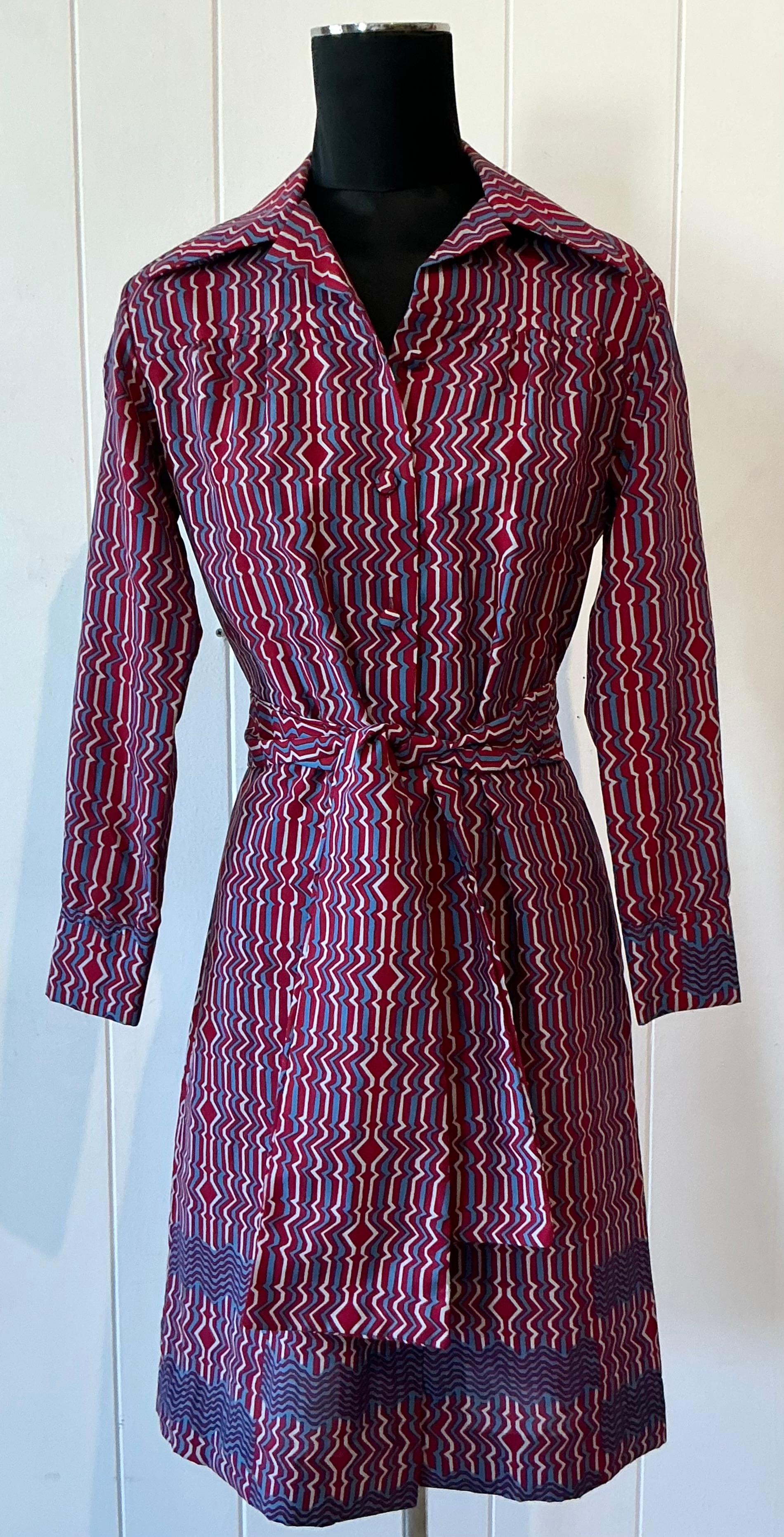 Capture the essence of vintage French elegance with this stunning Lanvin Paris blue and red patterned dress. A true testament to the brand’s iconic design heritage, this dress effortlessly blends bold color with timeless sophistication. The rich