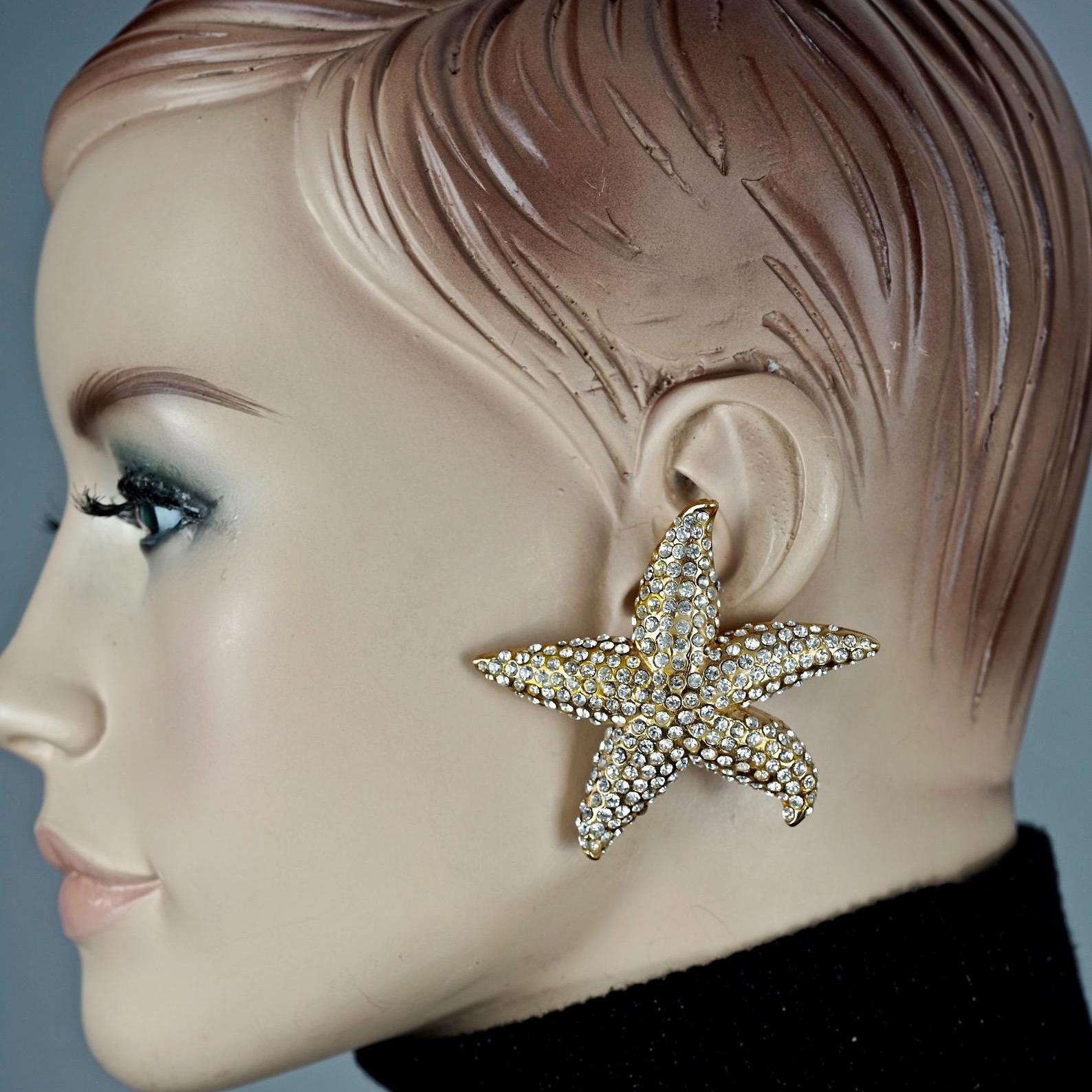 Vintage Lanvin Paris Star Fish Rhinestone Earrings

MEASUREMENTS:
Height: 2.36 inches (6 cm)
Width: 2.36 inches (6 cm)
Weight per Earring: 26 grams

Features:
- 100% Authentic LANVIN.
- Huge earrings in star fish form.
- Studded with clear