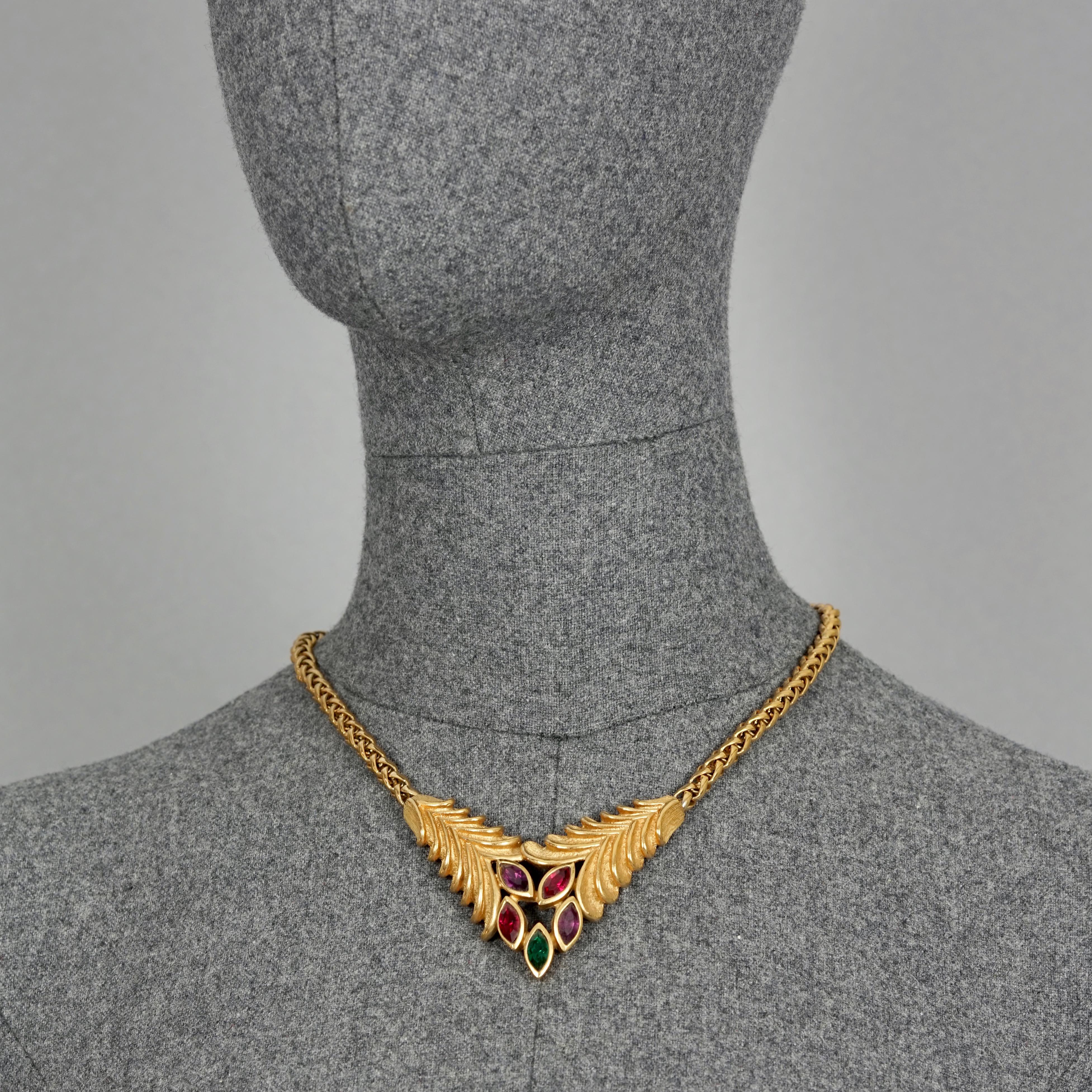 Vintage LANVIN Rhinestone Leaves Necklace

Measurements:
Height: 2.16 inches (5.5 cm)
Wearable Length: 15.75 inches to 17.12 cm (40 cm to 43.5 cm)

Features:
- 100% Authentic LANVIN.
- Jewelled leaves centrepiece.
- Gold tone hardware.
- Box clasp