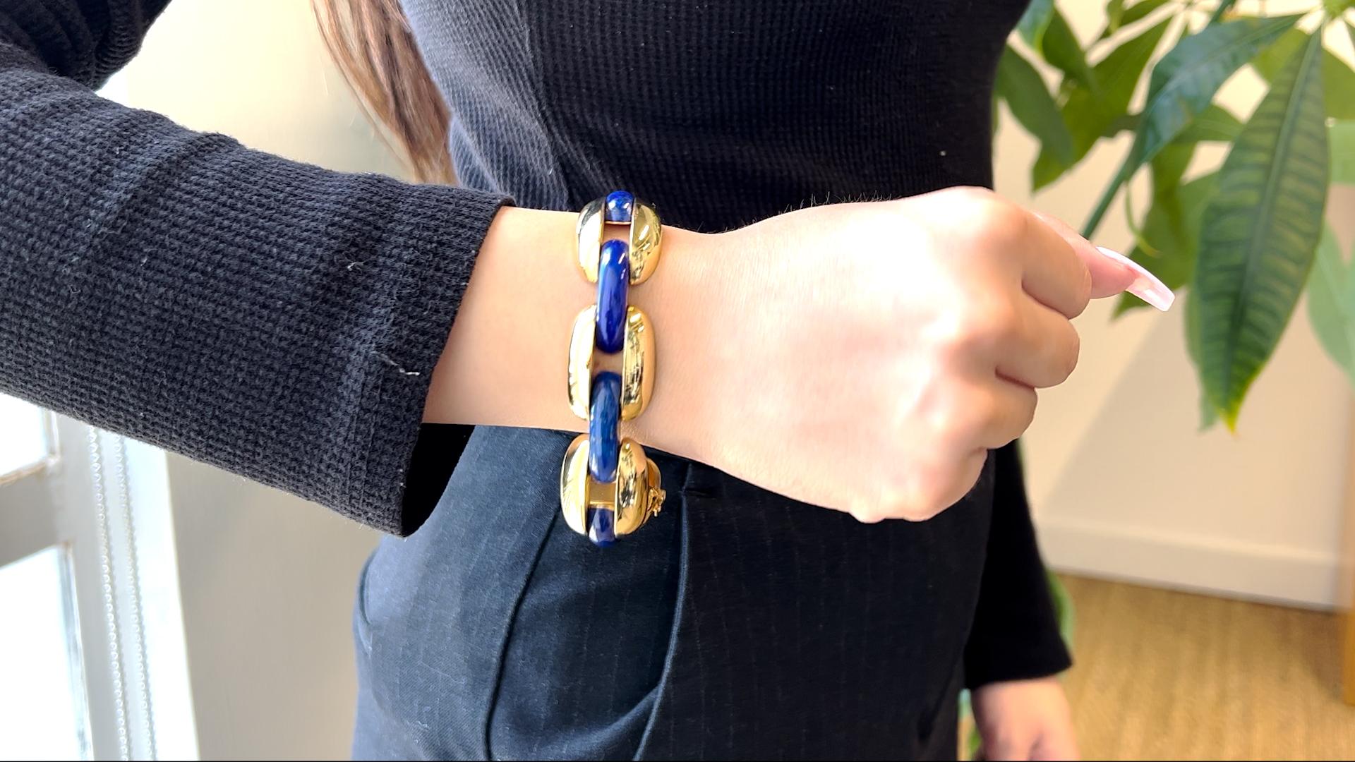 One Vintage Lapis 18 Karat Yellow Gold Link Bracelet. Crafted in 18 karat yellow gold with lapis lazuli with purity marks. The bracelet weighs 82.64 grams. Circa 1970. The bracelet is 7 inches in length by ¾ inch in width.

About this Item: There's