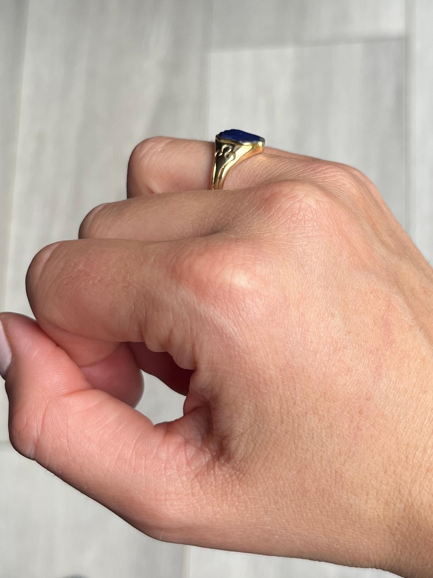 This gorgeous shield shaped lapis stone is set within a beautifully engraved 15ct gold ring. The stone is a lovely blue colour and has flecks of gold you would expect from the stone. 

Ring Size: J 1/2 or 5 
Stone Dimensions: 9x8mm 

Weight: 2.7g