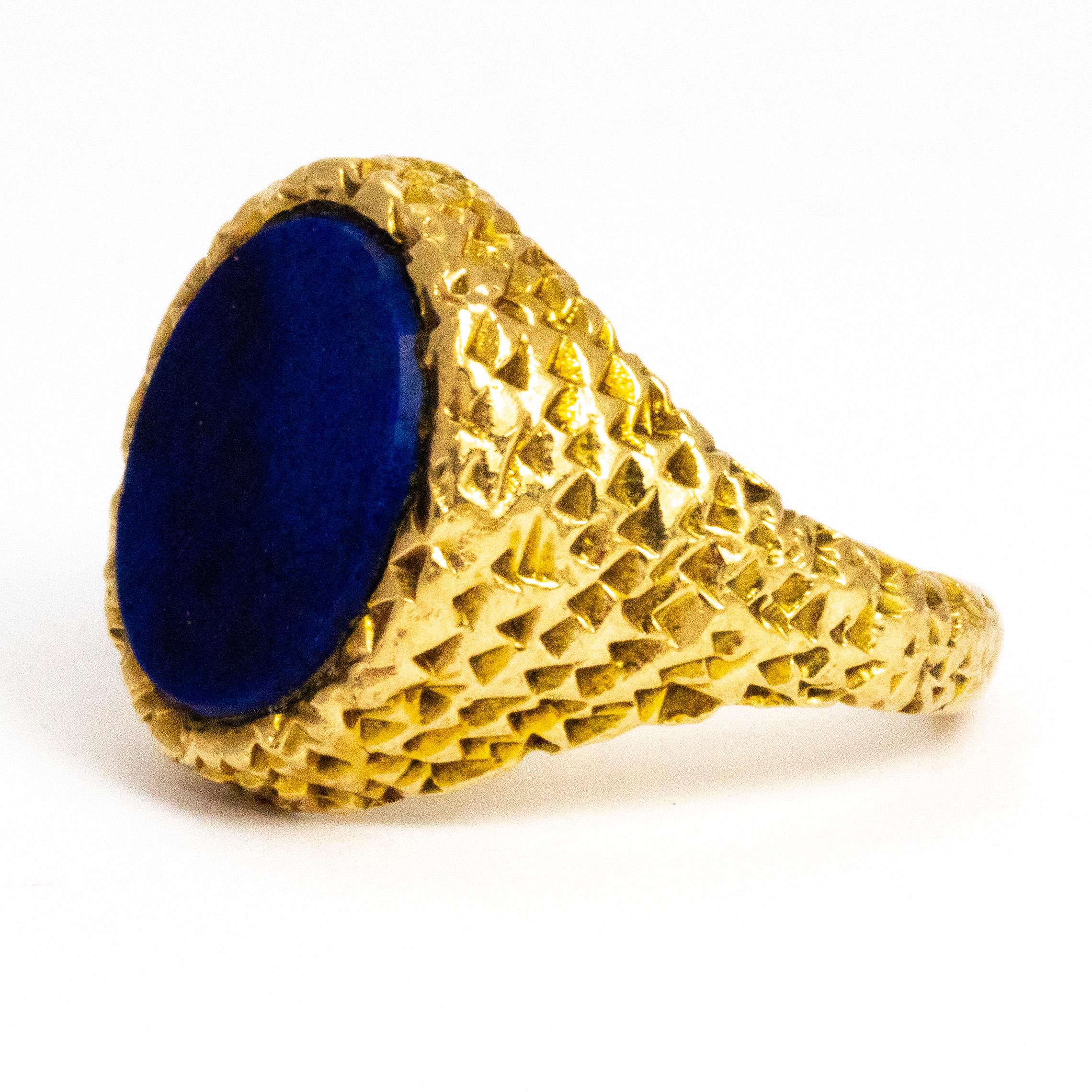 How wonderful are the shoulders on this ring!? The gold on this ring is moulded to create the effect of feathers and bring gorgeous texture. The beautiful bright blue stone set into this magical ring has wonderful tones running though it and a small