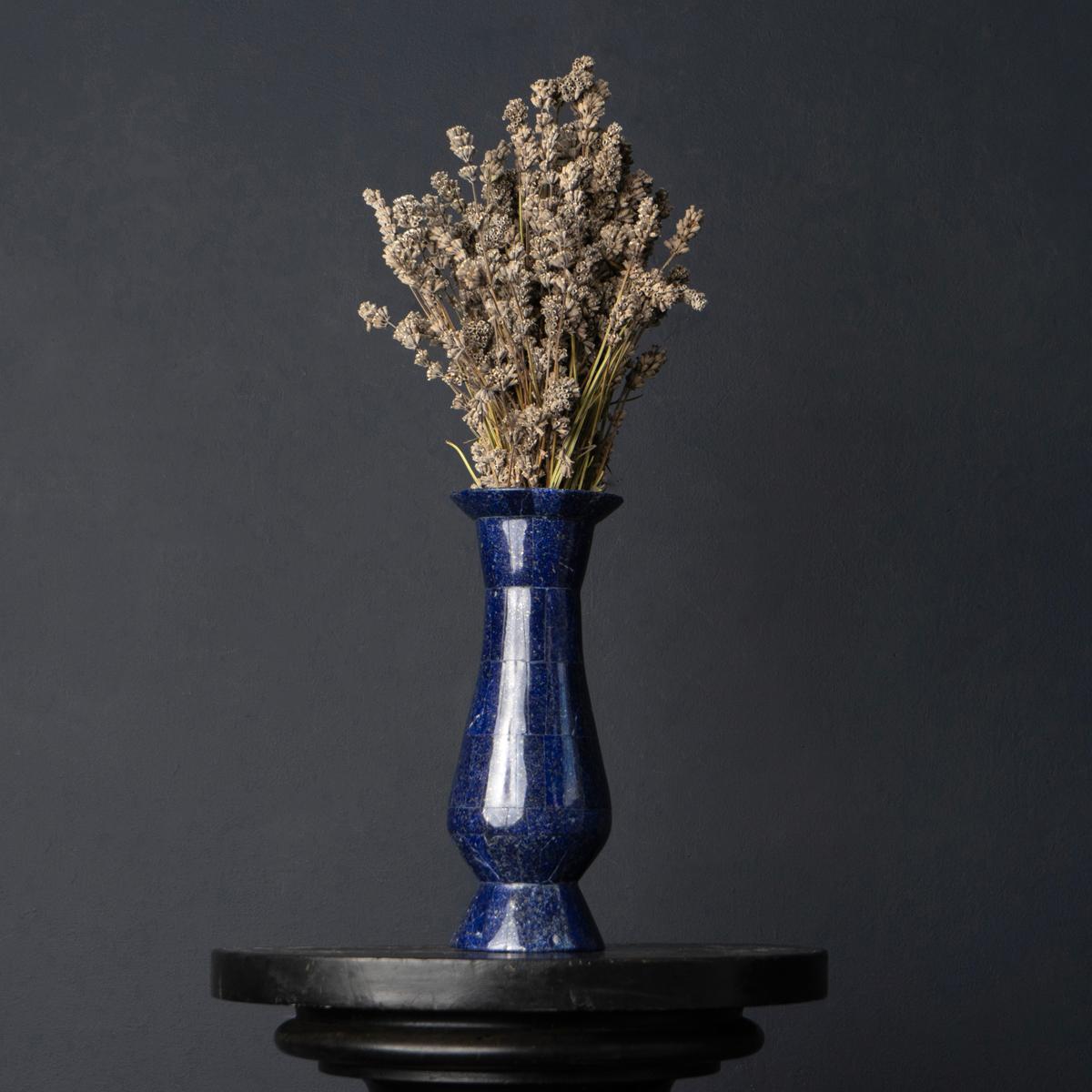 Semi-precious stone vase.
Stunning deep blue natural lapis lazuli stone with sparkly gold pyrite inclusions.

Skilfully handcrafted cutting and polishing each stone into the overall baluster form.

Dating from the early-mid 20th century.

It