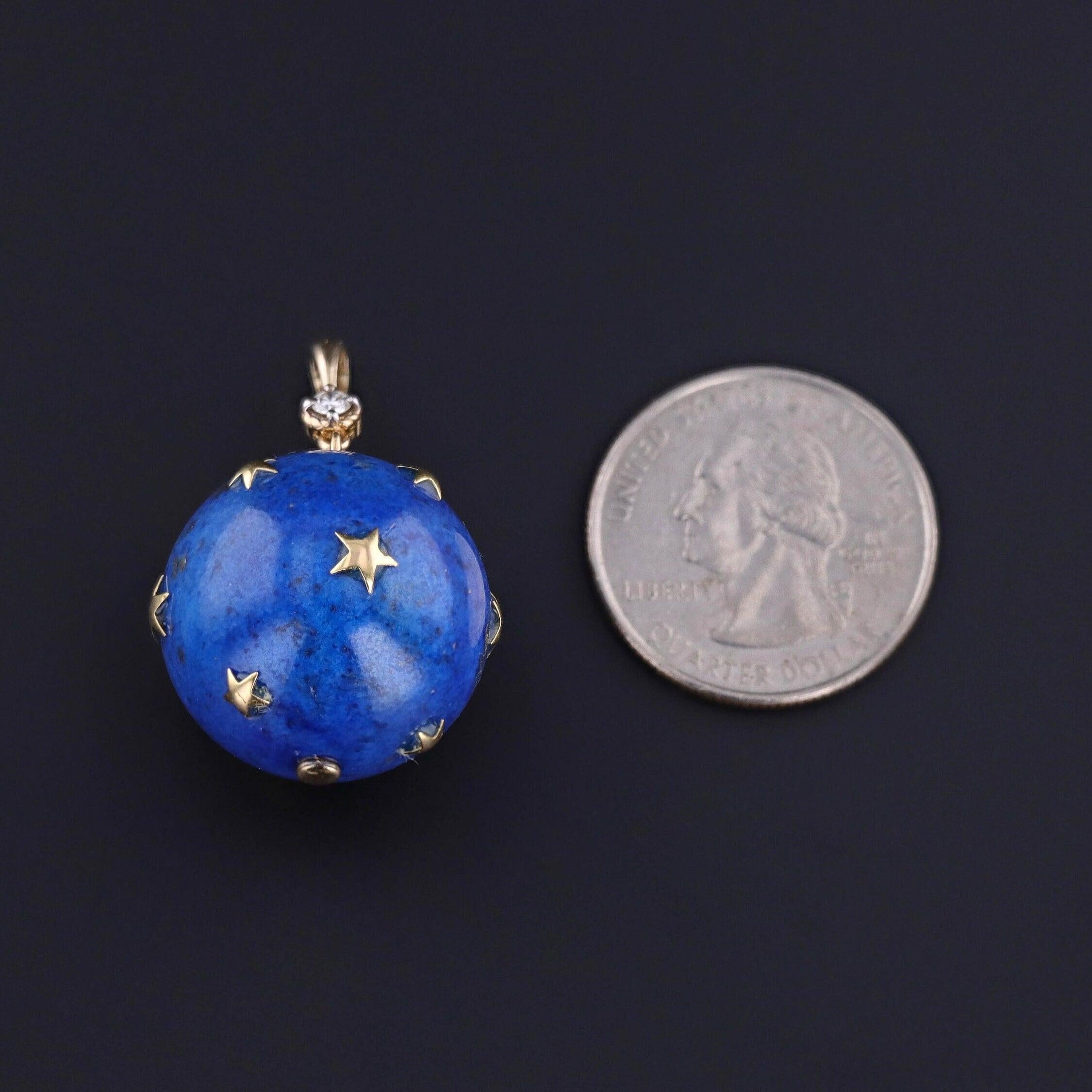 This pendant features a sphere of lapis lazuli with 18k gold stars and a 14k gold and diamond bail. The piece was one of two pendants that our jeweler created from a pair of vintage earrings (circa 1980).

The pendant measures 1.4 inches from the