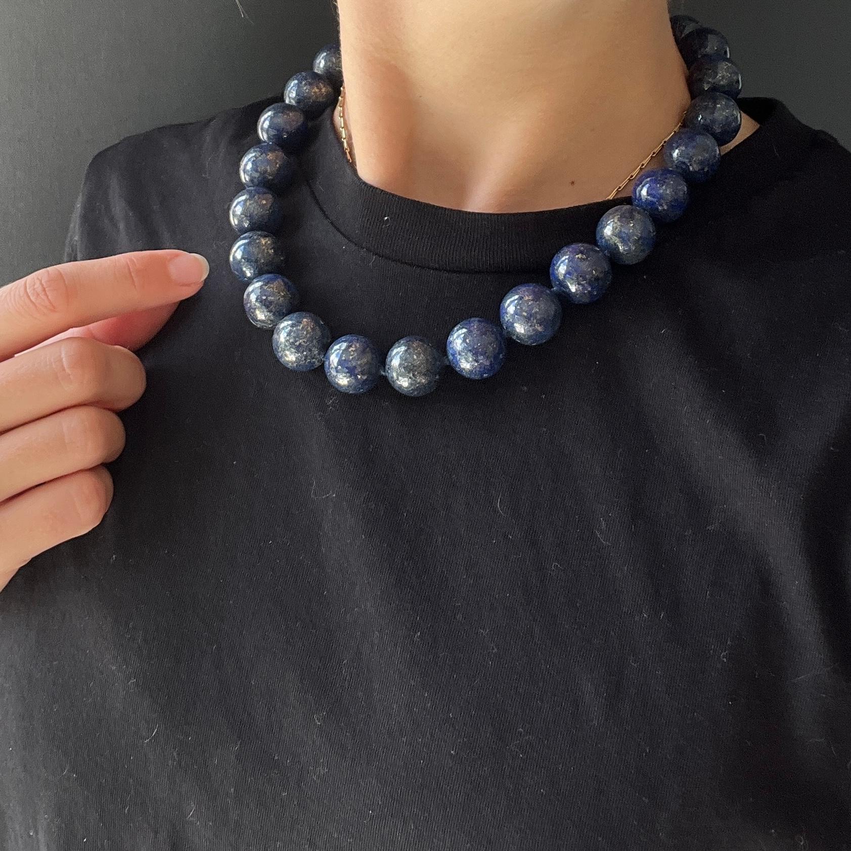 The blue of the gorgeous lapis stone beads really pop in this necklace. The beads are all the same size and the necklace is fastened using a giant bolt clasp. 

Length: 46cm
Bead Diameter: 16mm

Weight: 168g
