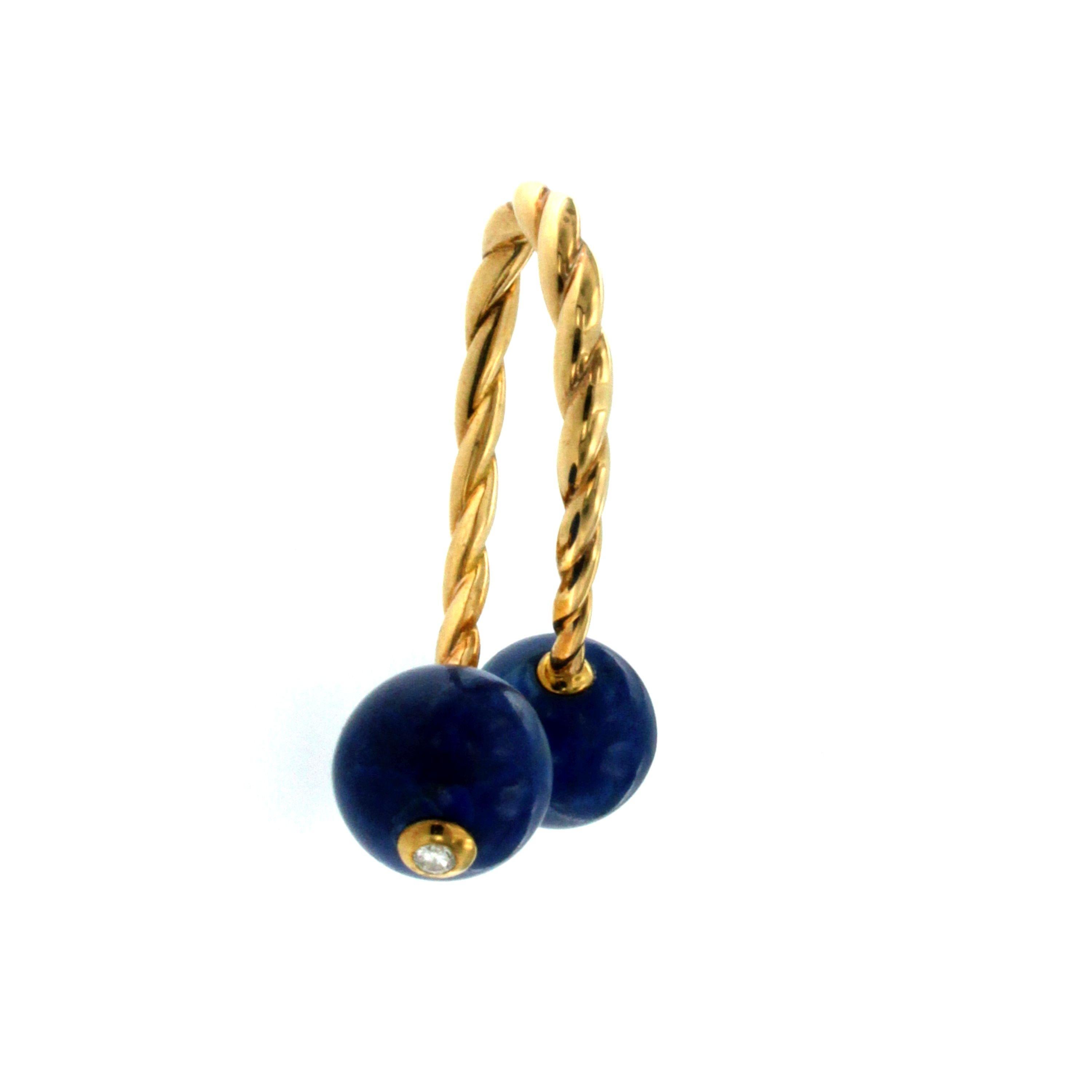 One of a Kind 18k Gold key ring, original from 1970, set with two Lapis Lazuli marbles adorned  by two round European cut Diamonds graded I color VVS, set at the bottom in a gold square.
Unscrewing and screwing the Lapis Lazuli marbles, you can