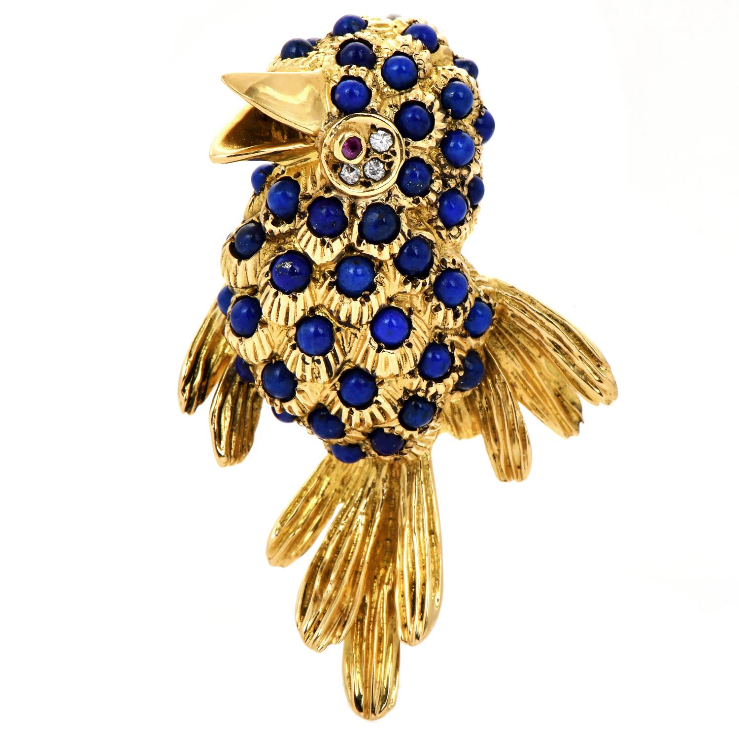 A  Vintage Blue Bird pin is crafted in solid 18K yellow gold.

The Eye is elaborated with 3 genuine pave set round fancy natural diamonds approx. 0.05 carats, and G-H color, VS clarity, and a red ruby approx. 0.01 carats

The body of the bird is