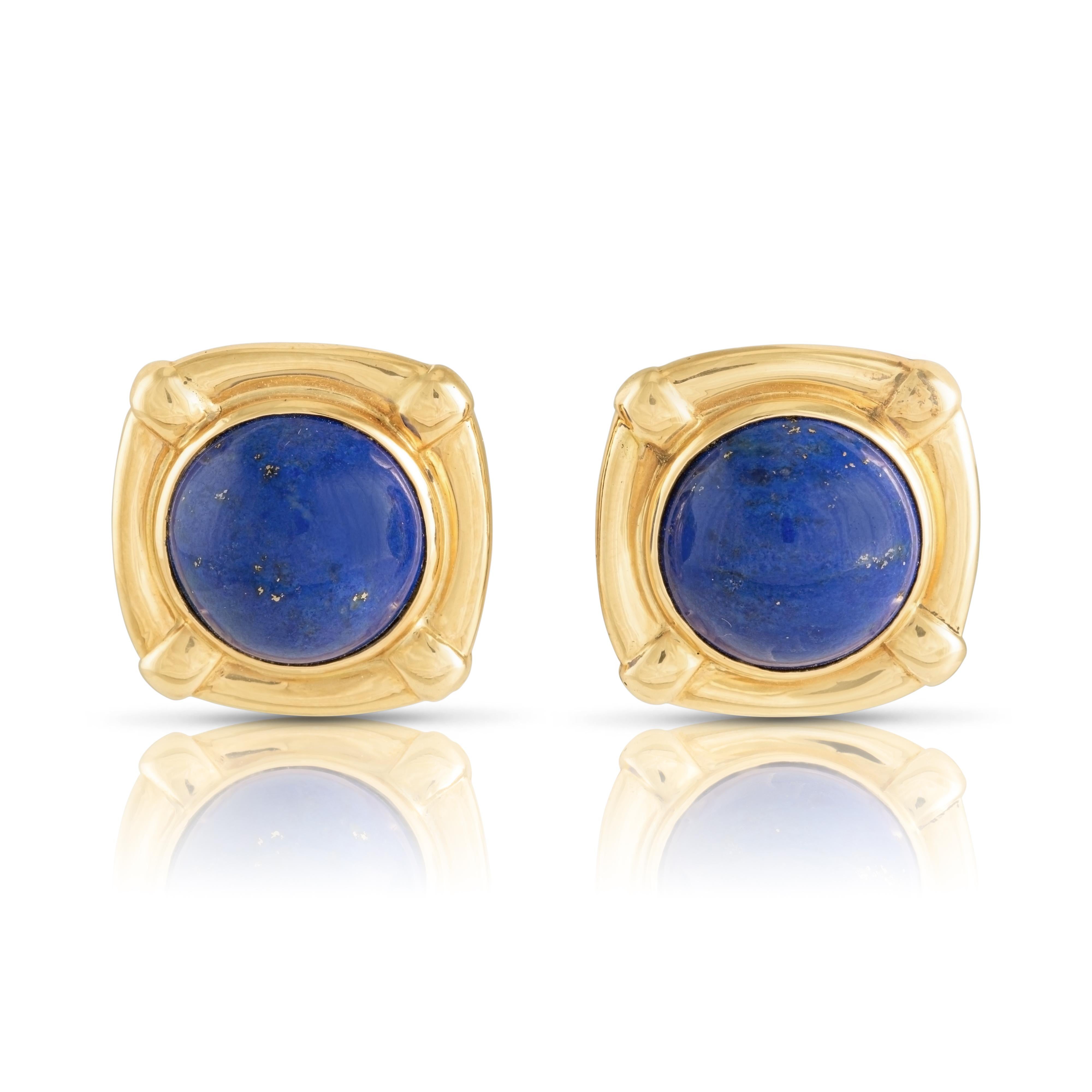 A gorgeous pair of late-twentieth-century lapis lazuli earrings for making a bold and colourful statement on any occasion. The two round lapis cabochons boast the most electrifying blue hue and are set in gleaming 18ct yellow gold square frames with