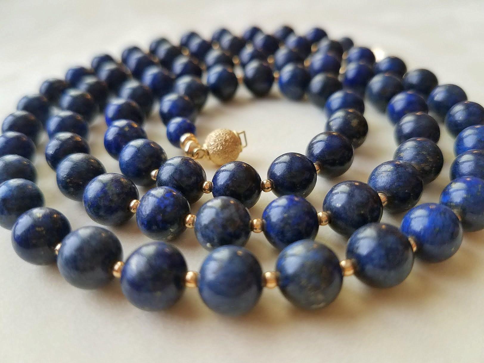The length of the necklace is 29 inches (73.6 cm). The size of the beads is 7 mm.
The beads are saturated dark blue with inclusions of gold pyrite.
Authentic, natural color. No thermal or other mechanical treatments were used.
The necklace is