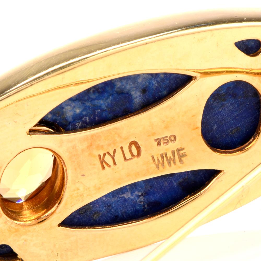This beautiful vintage lapis, diamond and citrine brooch is crafted in 18-karat yellow gold, weighing 19.2 grams and measuring 54mm long x 19mm wide. Resembling a leaf or surfboard shape this pin is bezel set with an oval carved lapis lazuli.