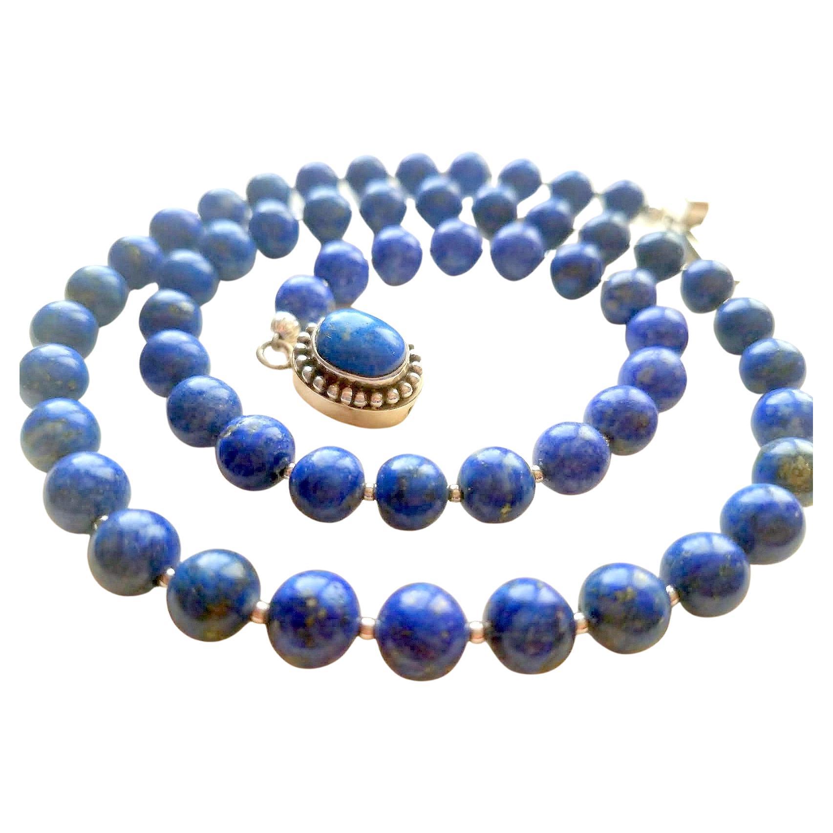 The length of the necklace is 22 inches (55.8 cm). The size of the smooth round beads is 8 mm.
Beads of deep blue color with inclusions of gold pyrite.
Natural, natural color. No thermal or other mechanical treatments were used.
The necklace is