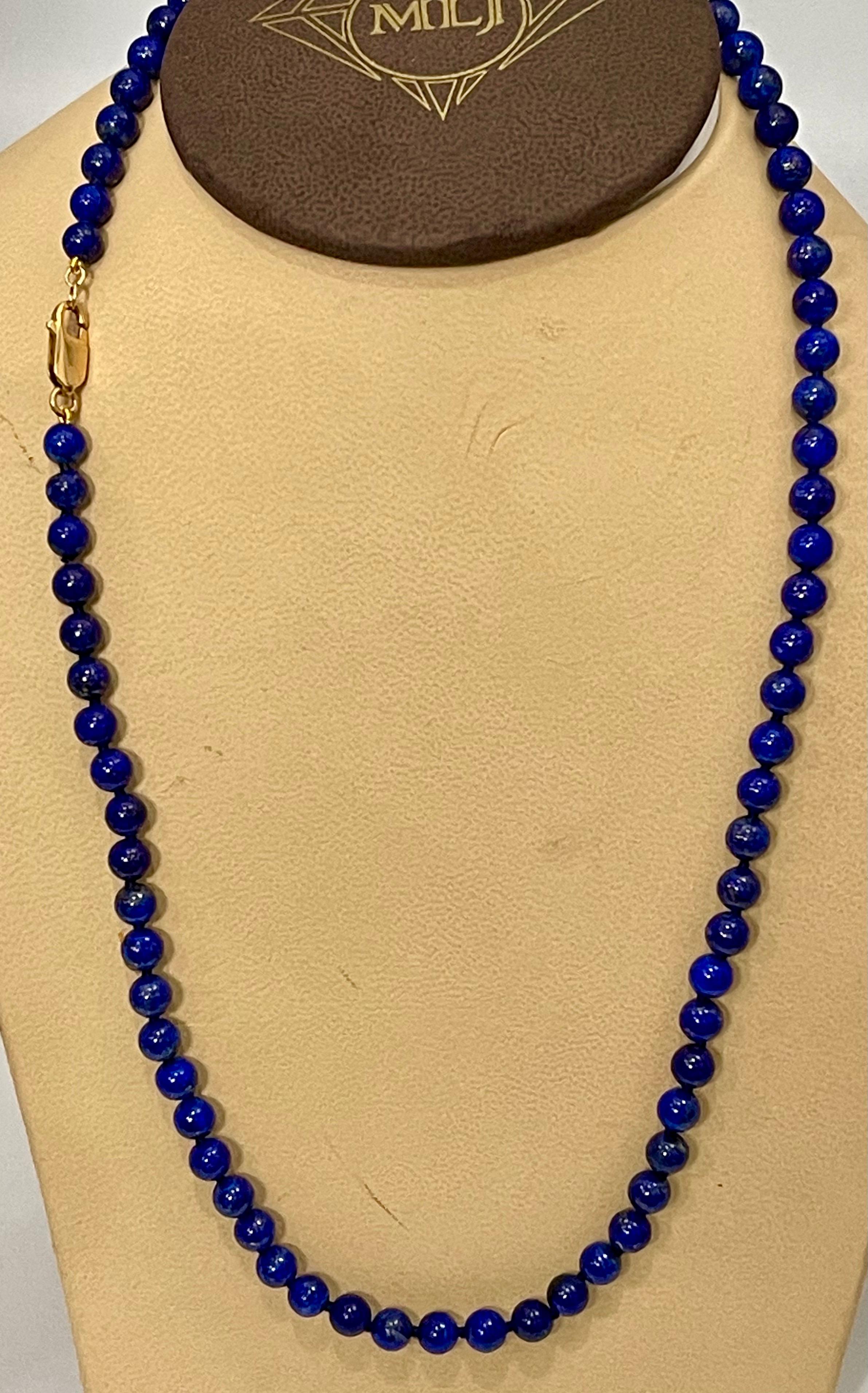 Vintage Lapis Lazuli Single Strand Necklace With 14 Karat Yellow Gold  heavy yellow gold lobster clasp
This marvelous vintage Lapis Lazuli  necklace features 1 row of luscious  Beads
(measuring approximately average  6.5 mm)  
strand is 21 inches