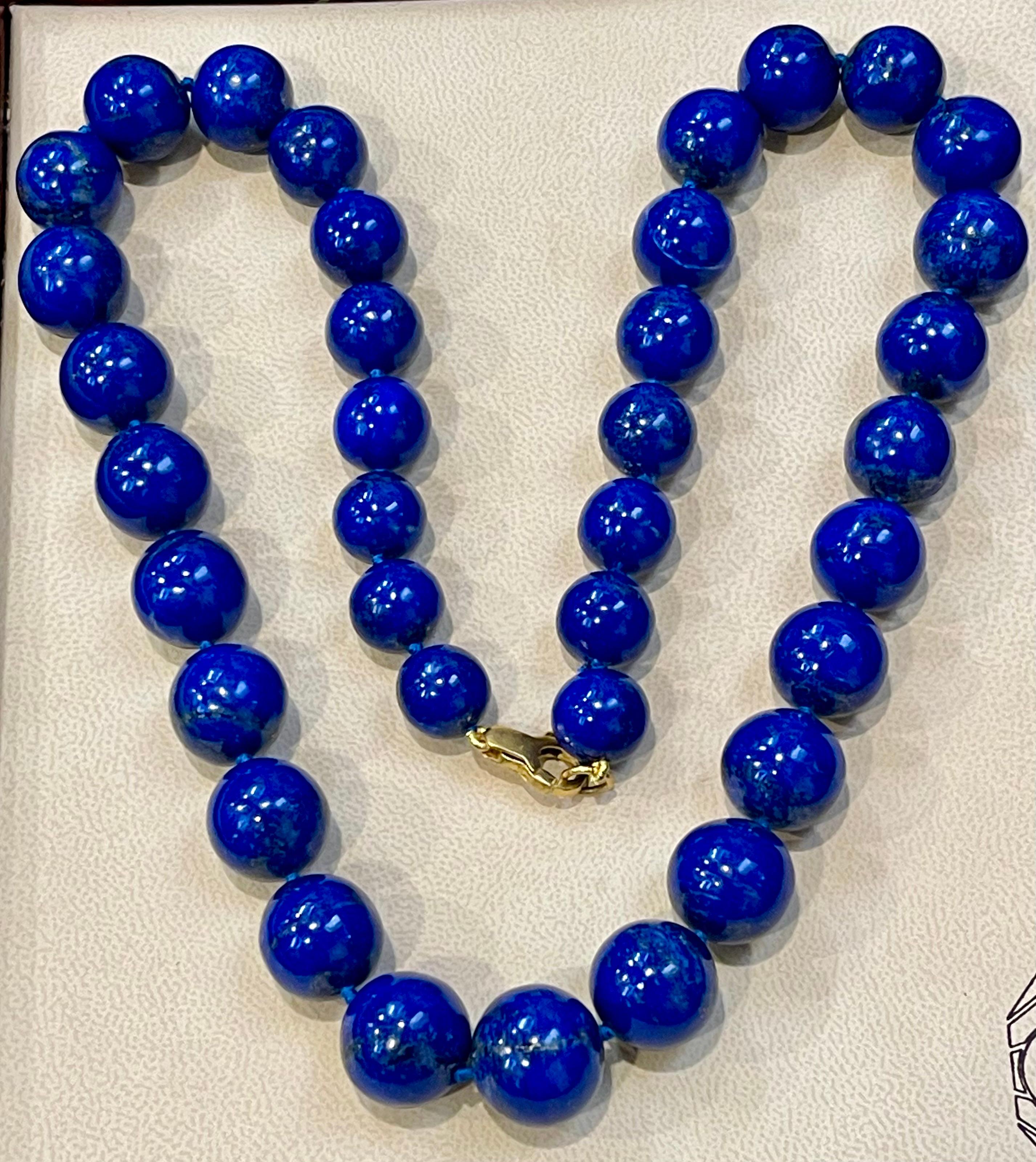 Vintage Lapis Lazuli Single Strand Necklace With 14 Karat Yellow Gold  Heavy Yellow gold Lobster clasp
This marvelous vintage Lapis Lazuli  necklace features 1 row of luscious  Beads
(measuring approximately average  17.5 to 13 mm)  
strand is 24