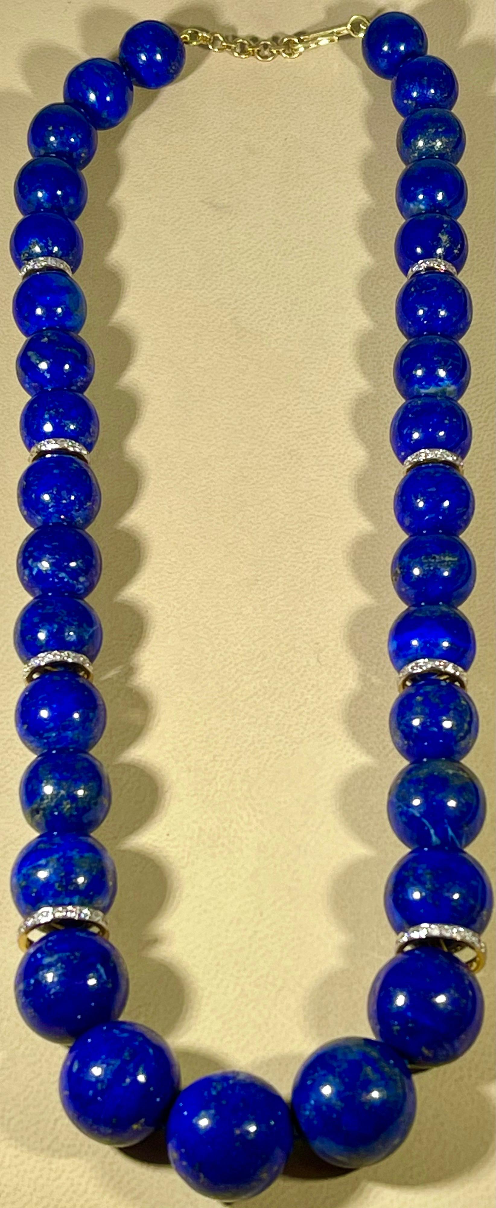 Vintage Lapis Lazuli Single Strand Necklace With Diamond &14 Karat Yellow Gold adjustable clasp
This marvelous vintage Lapis Lazuli  necklace features 1 row of luscious  huge Beads
(measuring approximately from  13-18 mm)  . It is a graduating