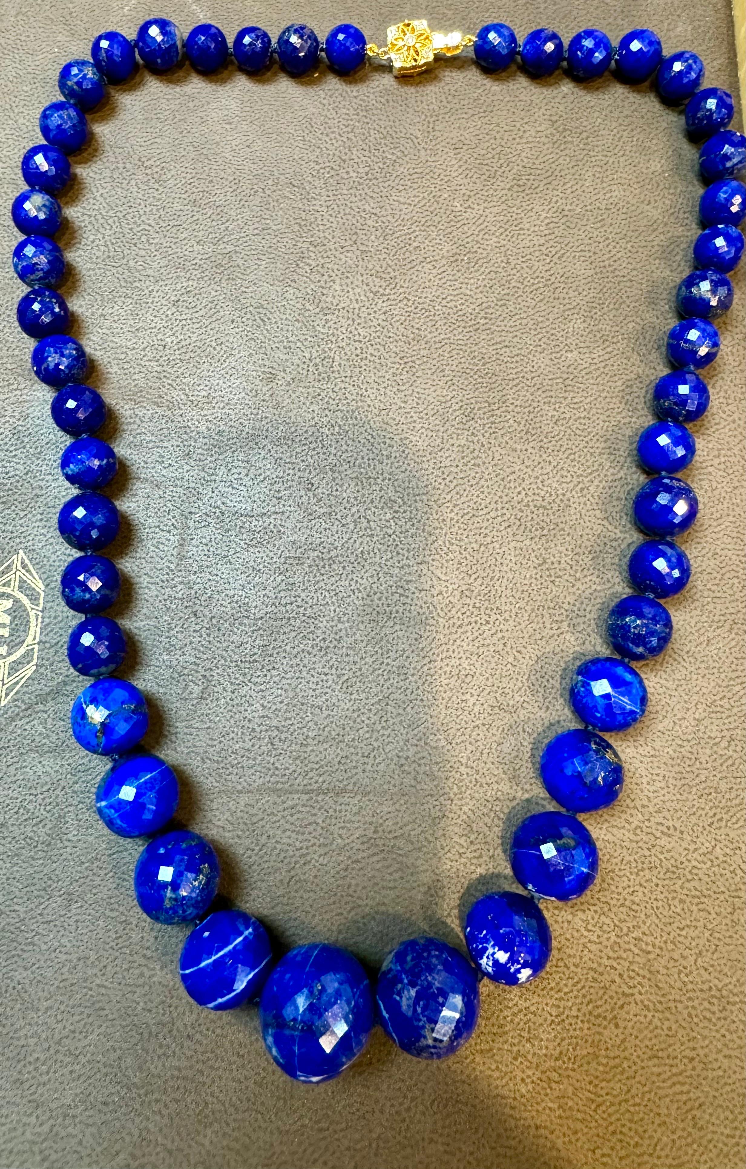 Vintage Lapis Lazuli Single Strand Necklace With Diamond & 18 Karat Yellow Gold clasp
This marvelous vintage Lapis Lazuli  necklace features 1 row of luscious  huge Beads
(measuring approximately from  9-18 mm)  . It is a graduating necklace 
strand