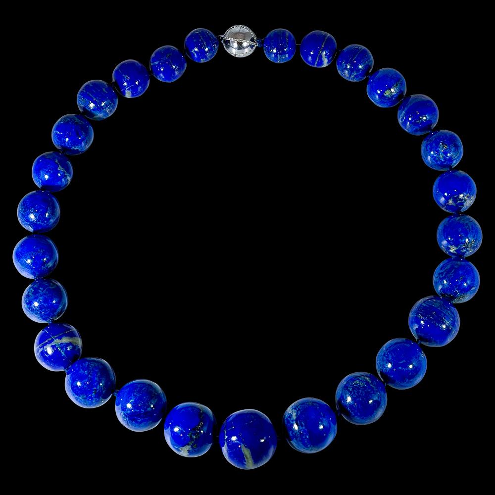 Vintage Lapis Lazuli Single Strand Necklace  with 1.1 Carat Diamond Ball  Clasp in 14 Karat  White Gold
This marvelous vintage Lapis Lazuli  necklace features 1 row of luscious  huge Beads
(measuring approximately from  23 MM to 16 MM)  . It is a