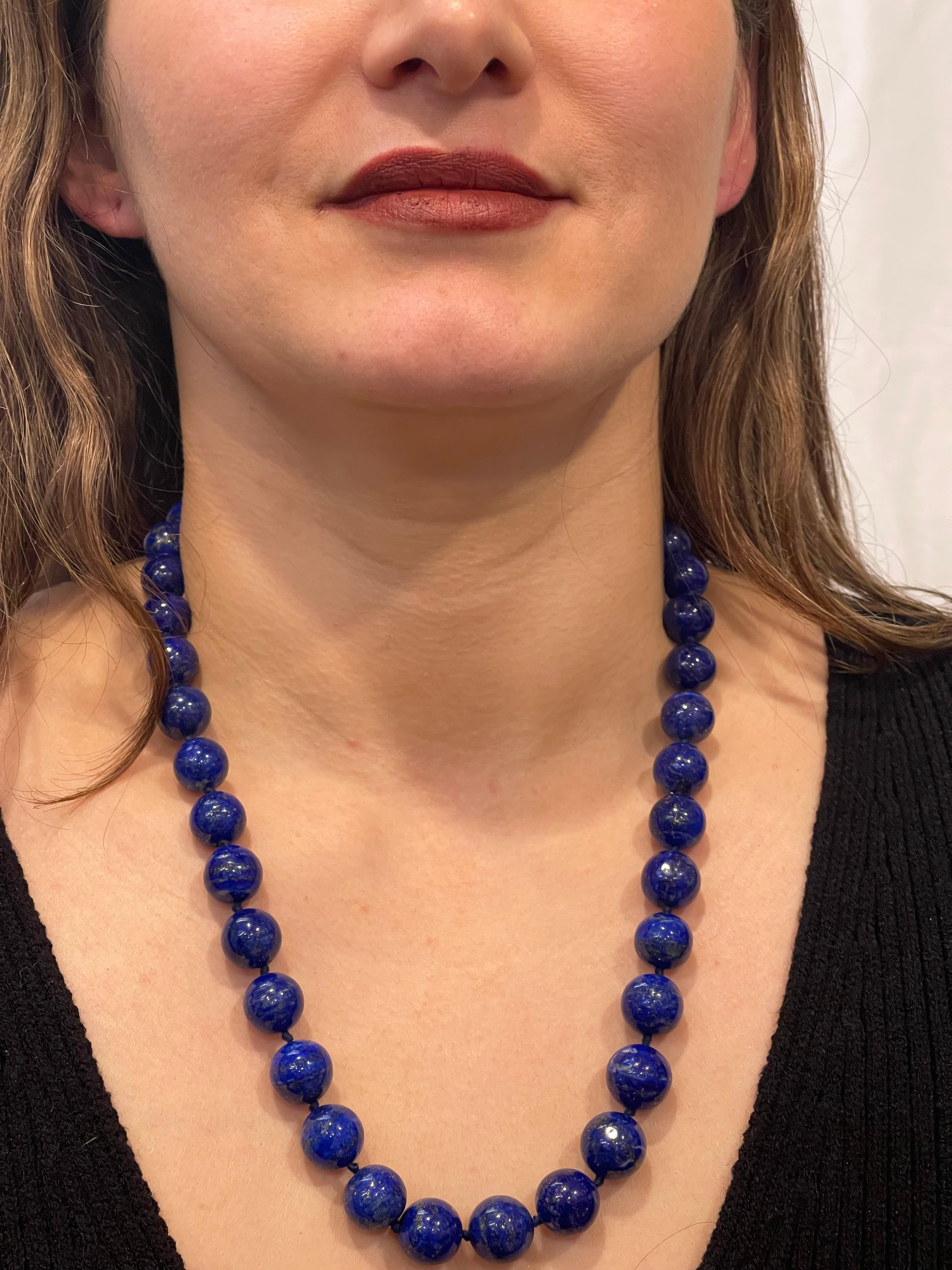 Vintage Lapis Lazuli Single Strand Necklace  with 1.1 Carat Diamond Ball  Clasp in 14 Karat  White Gold
This marvelous vintage Lapis Lazuli  necklace features 1 row of luscious  huge Beads
(measuring approximately from 16 MM to 13 MM)  . It is a