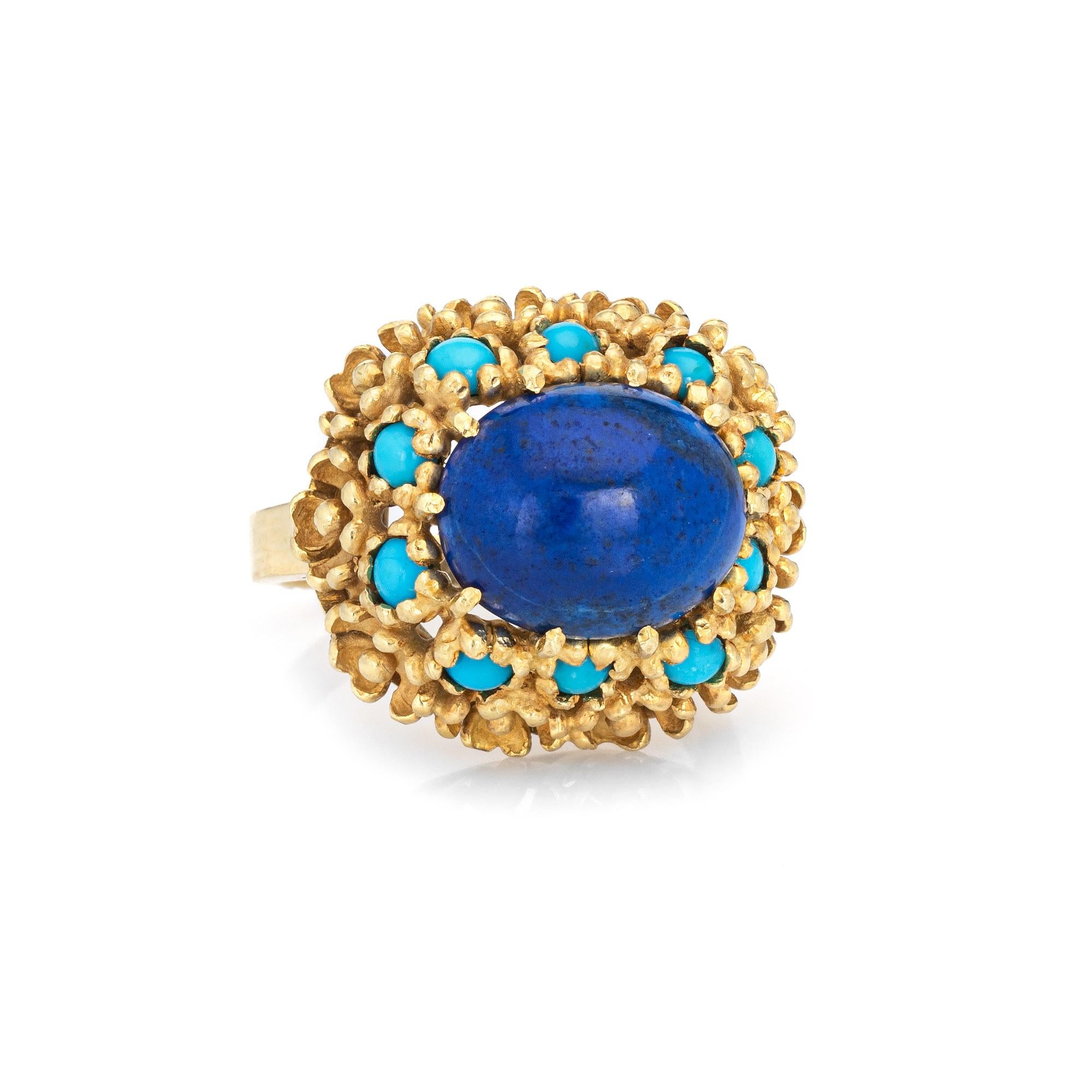 Stylish vintage lapis lazuli & turquoise ring (circa 1970s) crafted in 18 karat yellow gold. 

Lapis lazuli measures 12mm x 10mm (estimated at 4.50 carats). The turquoise cabochons each measure 2mm. The lapis & turquoise is in excellent condition