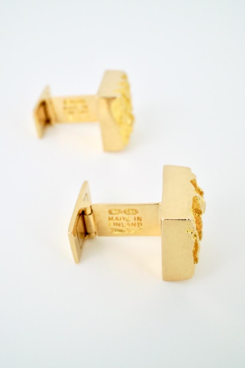 A vintage pair of 14k gold textured cufflinks - Bjorn Weckstrom - each cufflink of a small rectangular tablet with a heavily textured face and a sprung rectangular lever back fitting - these are wonderful links that have a lush nugget like texture