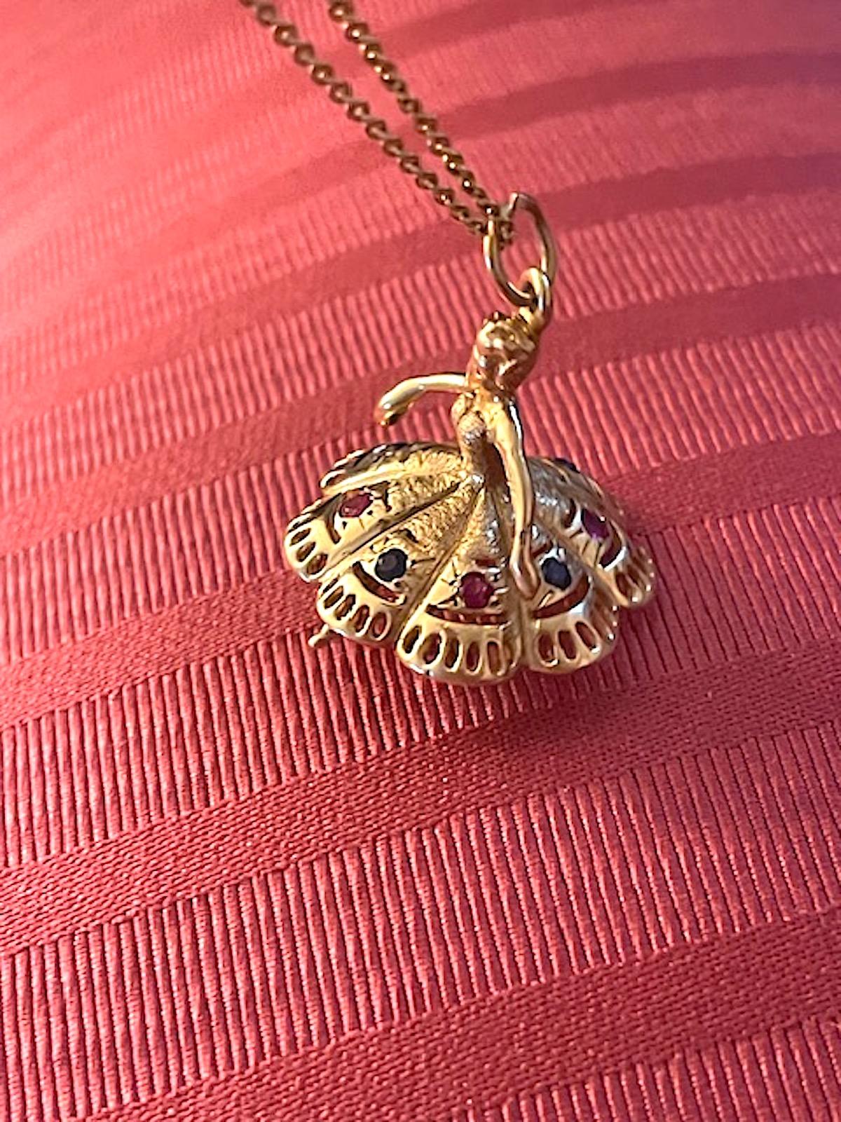 Round Cut Vintage Large 14k Gold Dancer Charm with Pink and Blue Sapphires For Sale