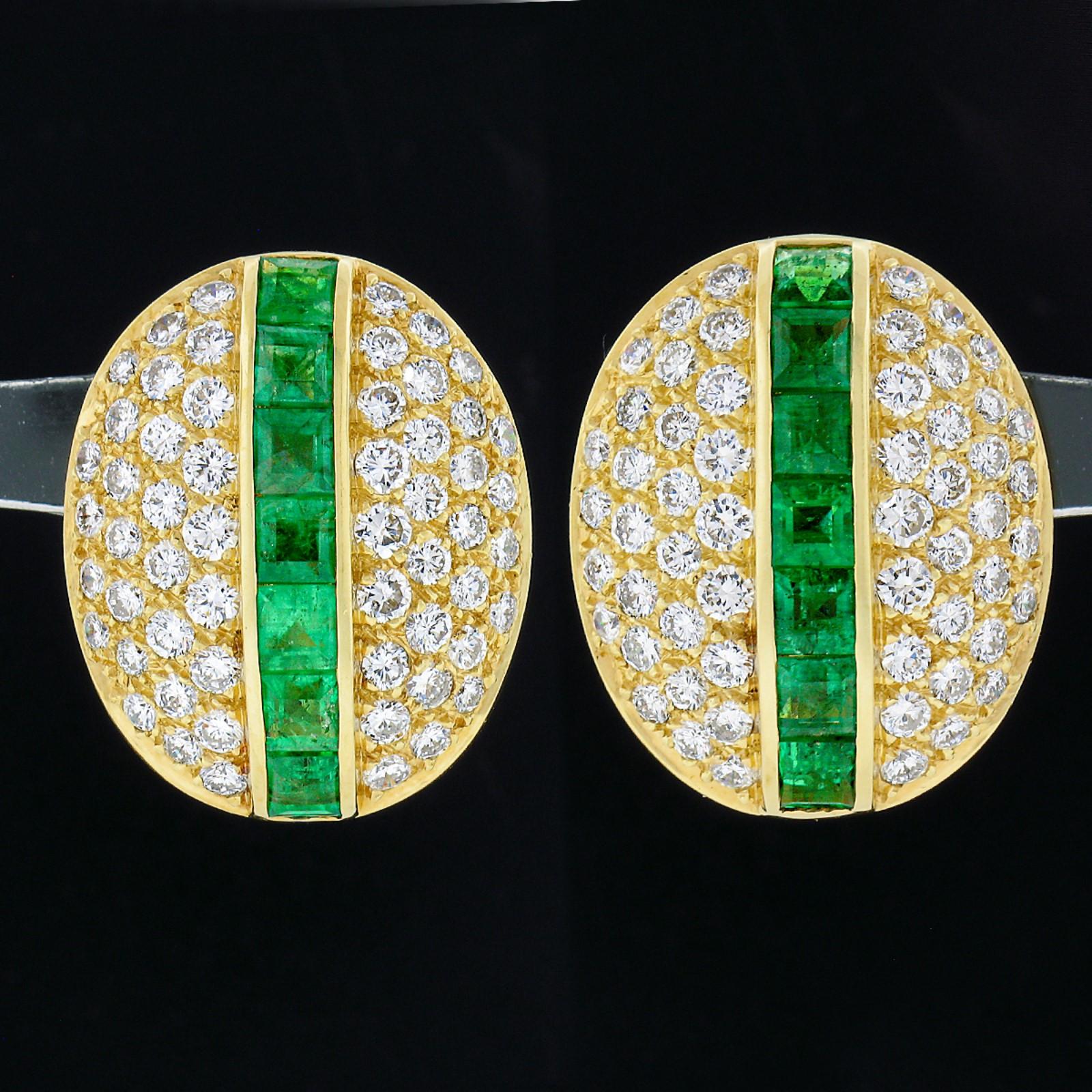 This magnificent vintage pair of natural emerald and diamond statement earrings was crafted from solid 18k yellow gold. The earrings feature beautiful square step cut emeralds that are perfectly channel set down the slightly raised center of the