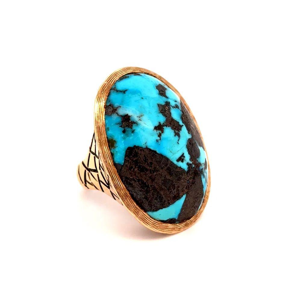 Simply Beautiful! Finely detailed Turquoise Gold Cocktail Ring. Centering a Hand set securely nestled 50 Carat Turquoise. Hand crafted detailed 14K Yellow Gold mounting. Ring size 9, we offer ring resizing. In excellent condition, recently