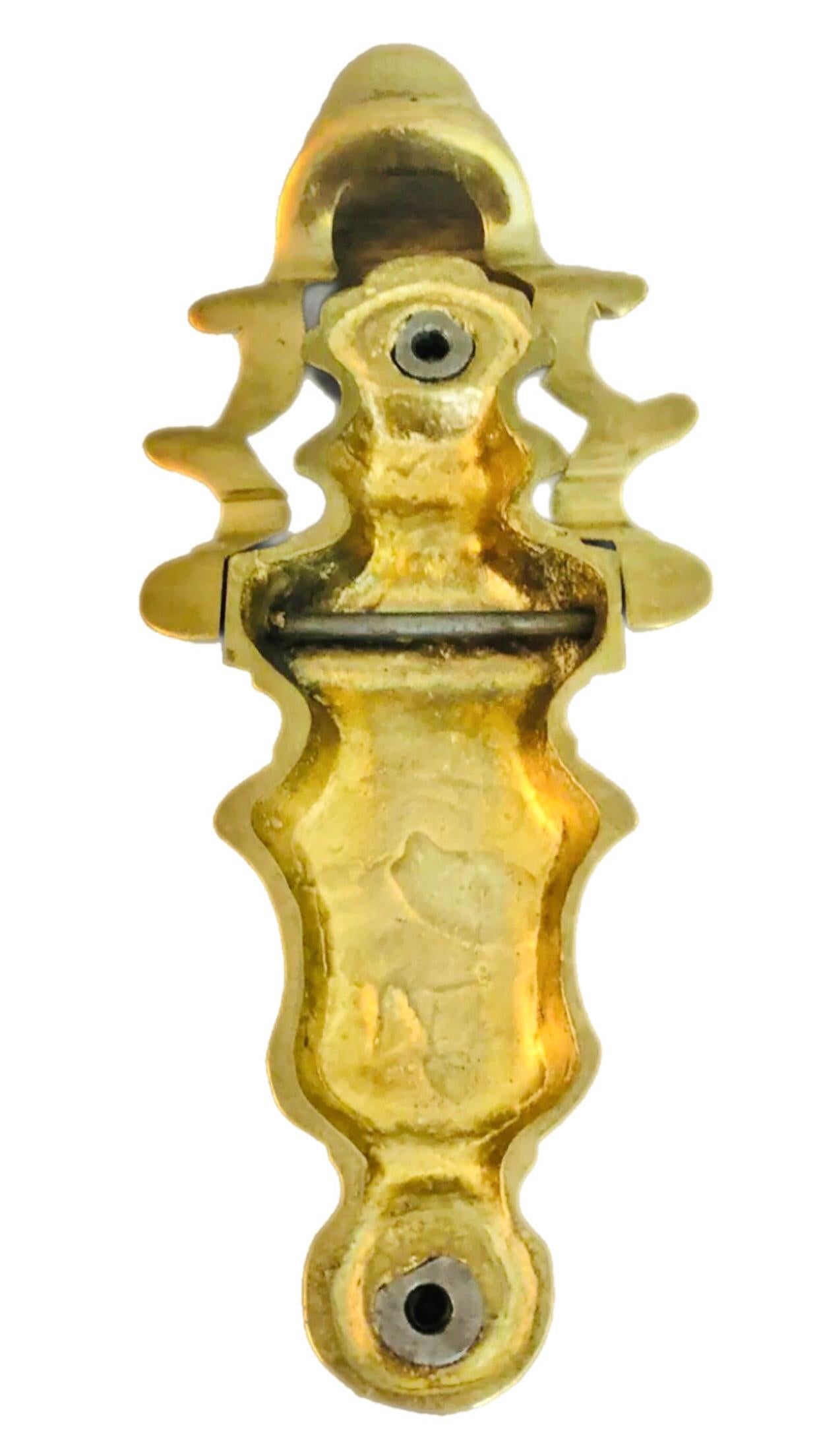 Large, Focal, Mid Century Modern, Solid Brass, Sculptural Door Knocker 

Elegant lines. Undulating Wavy Center Knocker. . Clean minimalist piece of door jewelry that would enhance the doorway of a modernist home 

Measurements 
7