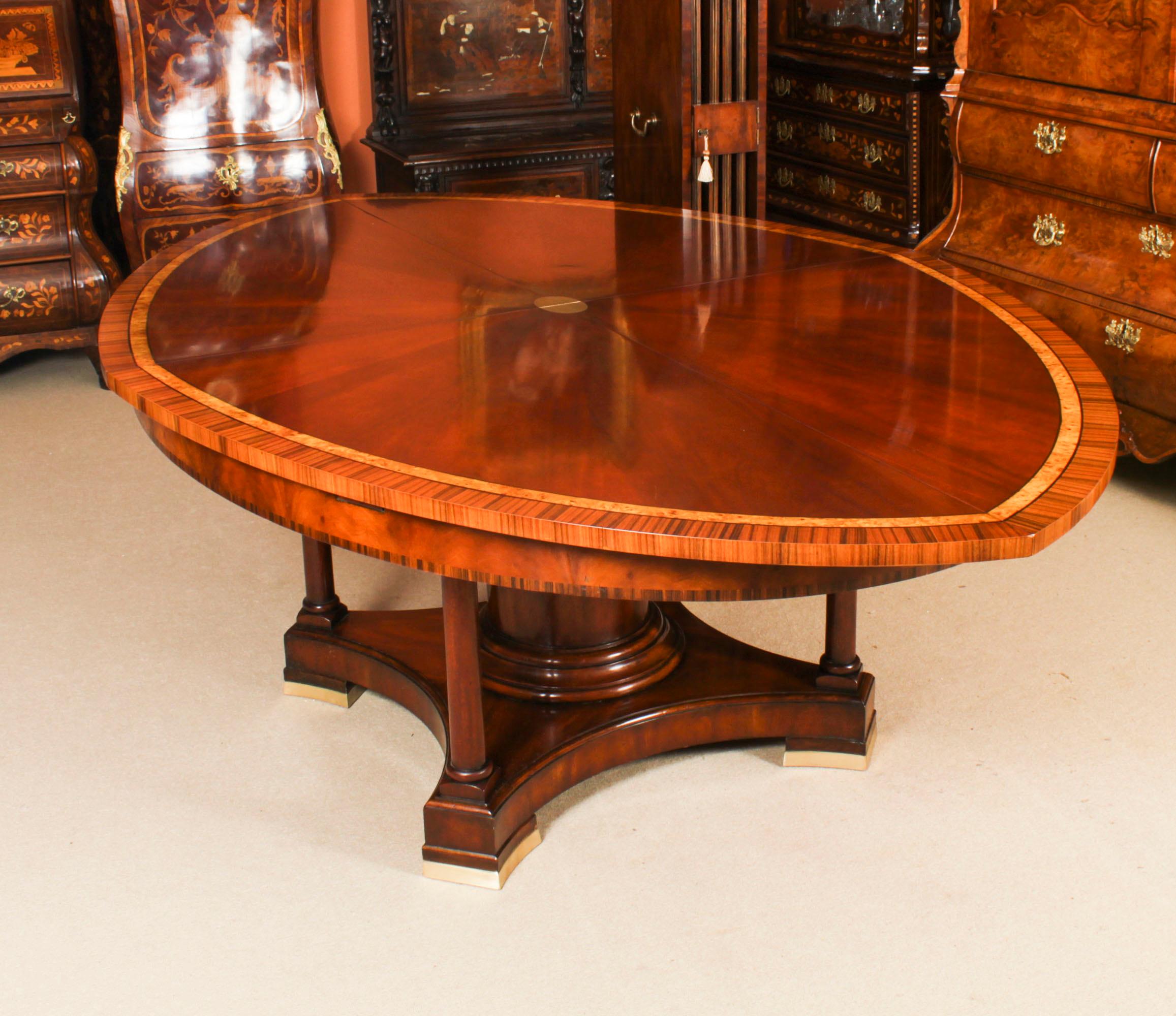 A superb oval flame mahogany and crossbanded  replica of Robert Jupe's flame mahogany extending dining table, dating from the second half of the 20th century.

The flame mahogany veneers on the top have been arranged so as to give a striking