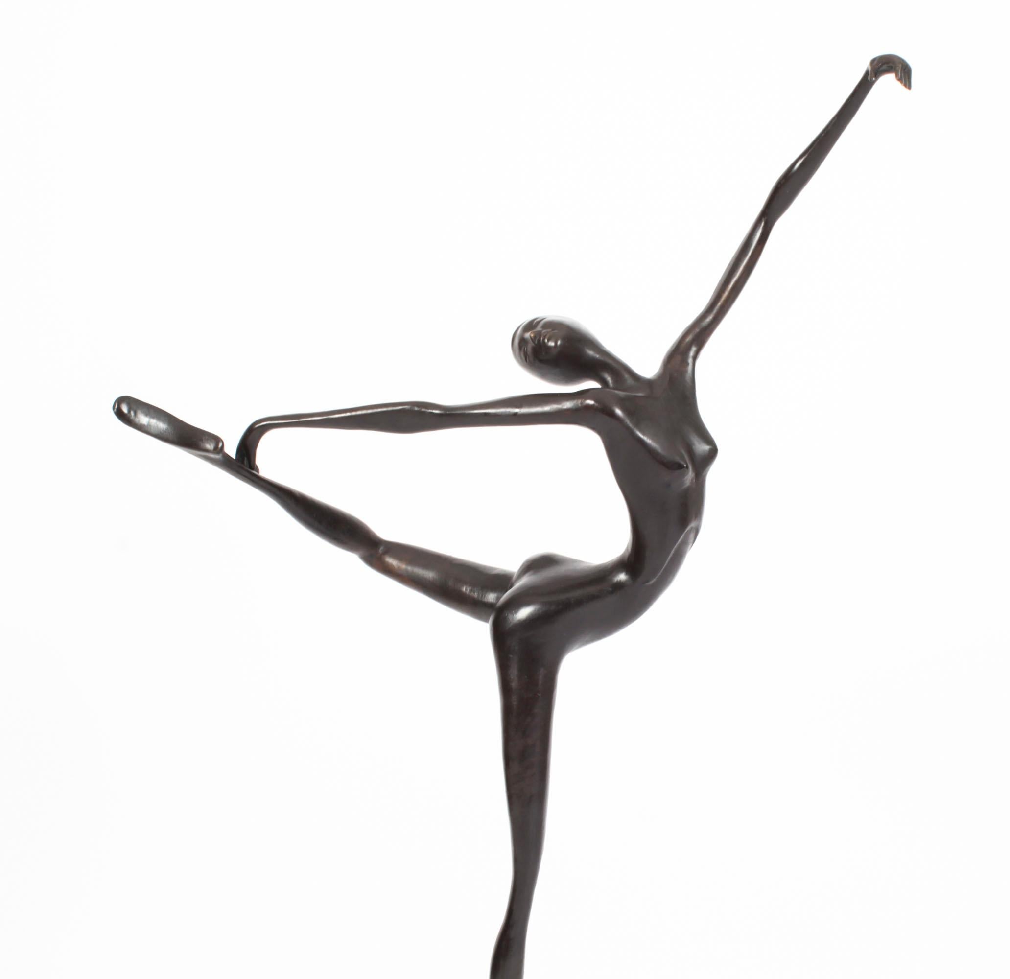 This is a large stunning bronze abstract sculpture of a dancer from the last quarter of the 20th century.

The naked female figure is represented in a dancing pose on a stepped cylindrical base.

The attention to detail is absolutely fantastic