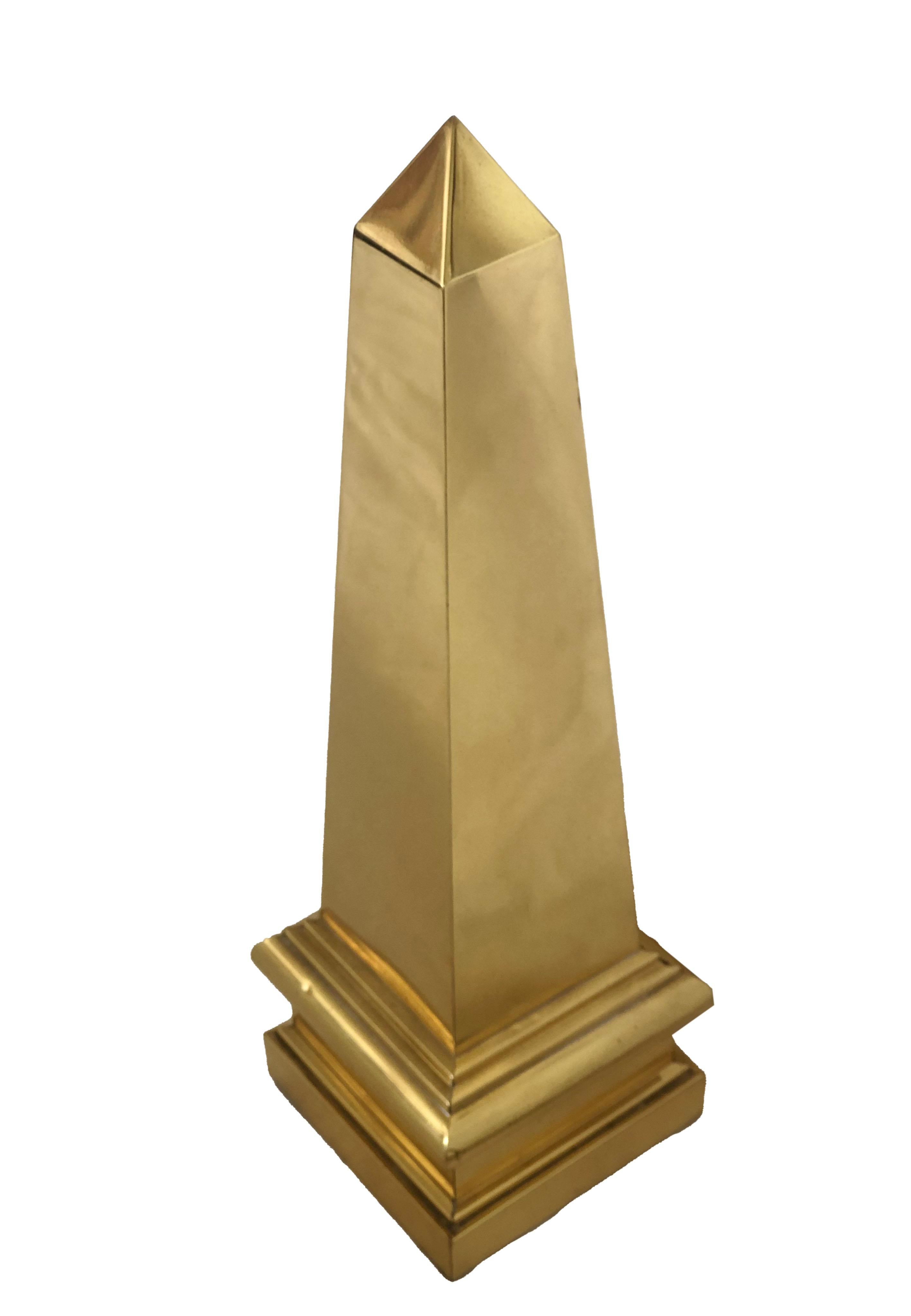 This brass obelisk is beautiful addition to any decor. It has been polished but can always shine a bit more!
