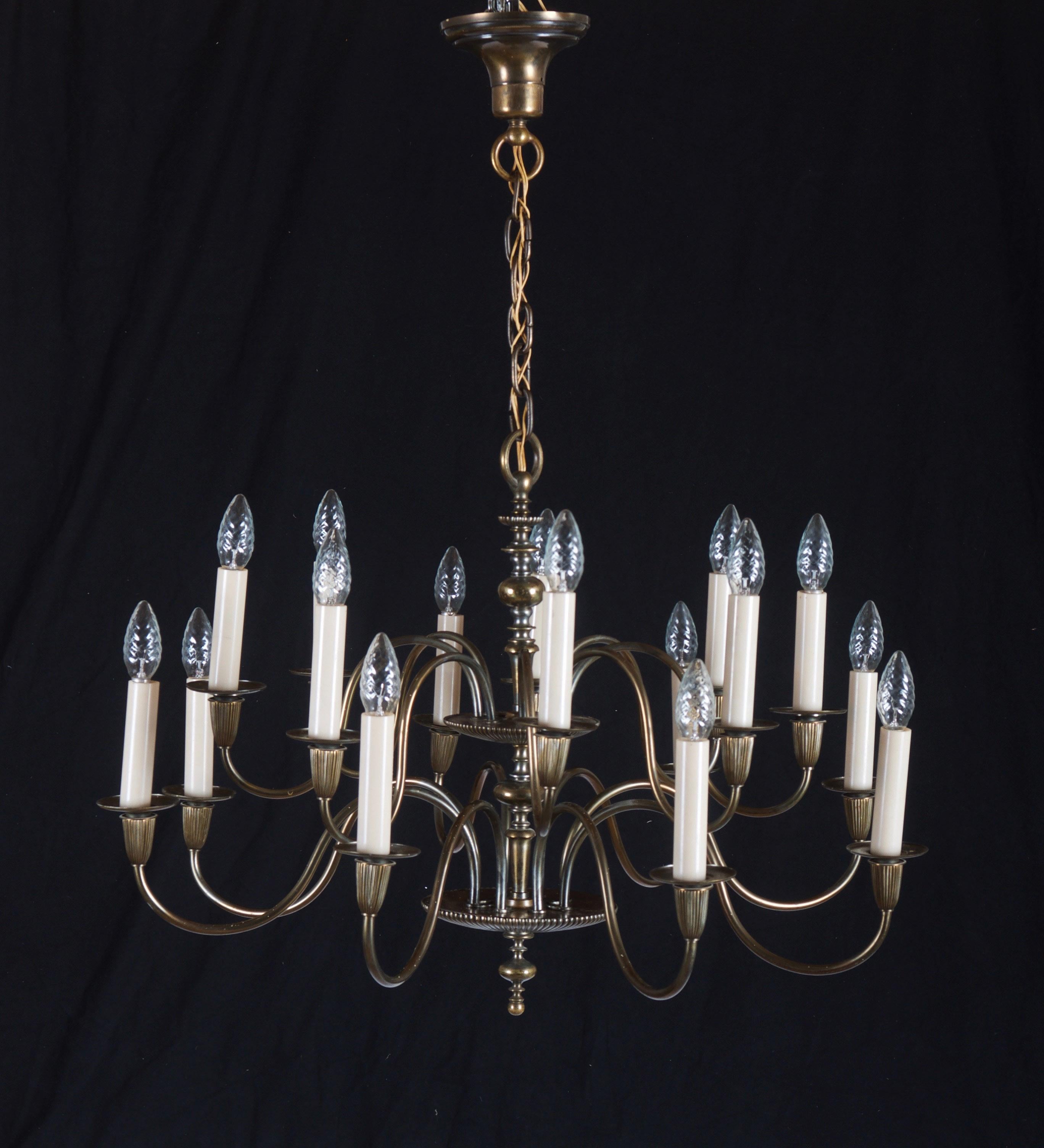 Chandelier in the style of a Flemish shank chandelier, made in the middle of the 20th century in Sweden, brass, sixteen arms, S-shaped curved arms fitted with E14 sockets.

 
