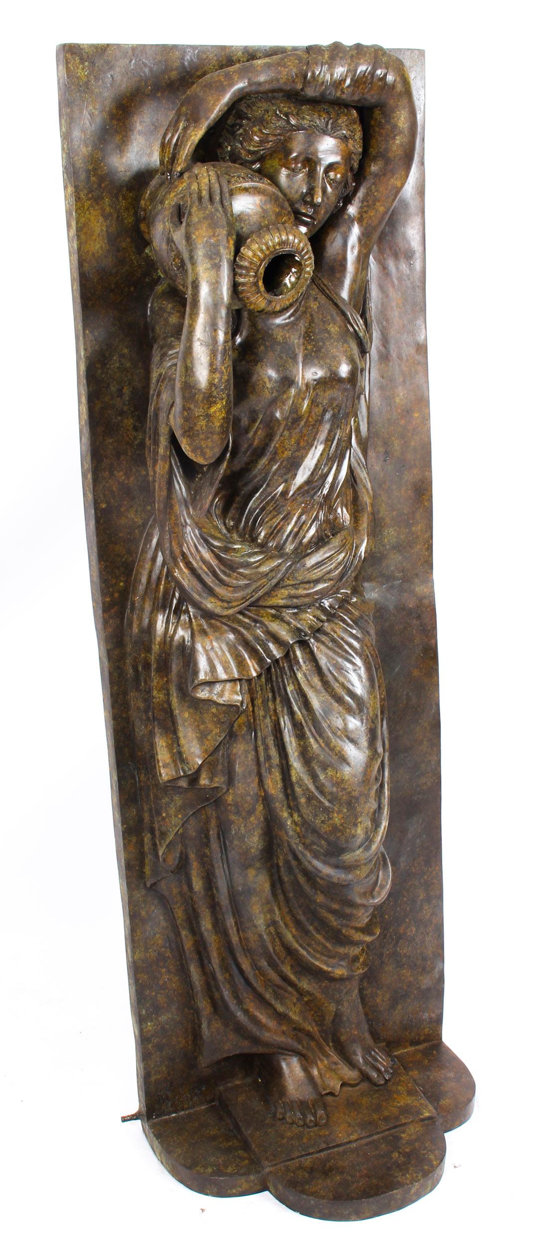This is a wonderful and high-quality solid bronze sculpture and fountain in the form of a delightful neoclassical lady holding an amphora, from the last quarter of the 20th century.

This beautiful large bronze statue features a composed lady