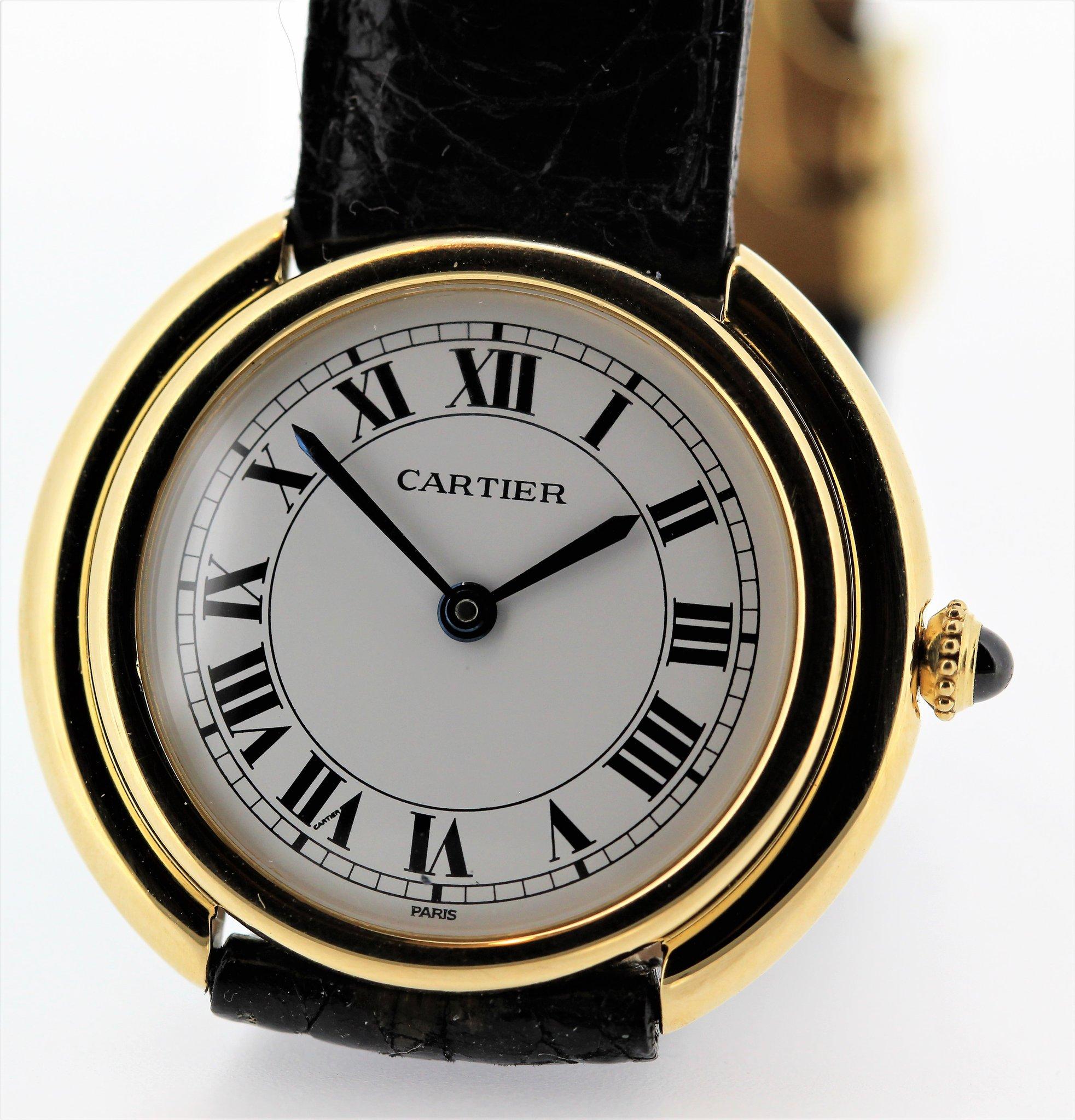 Introduction:
This Vintage Cartier Paris Vendome watch is the large size, circa 1975-1980.  It is 18K yellow gold and measures 33 mm with an automatic movement.  It has a Cartier crocodile strap and 18K Cartier Deployant Buckle.  It is Triple