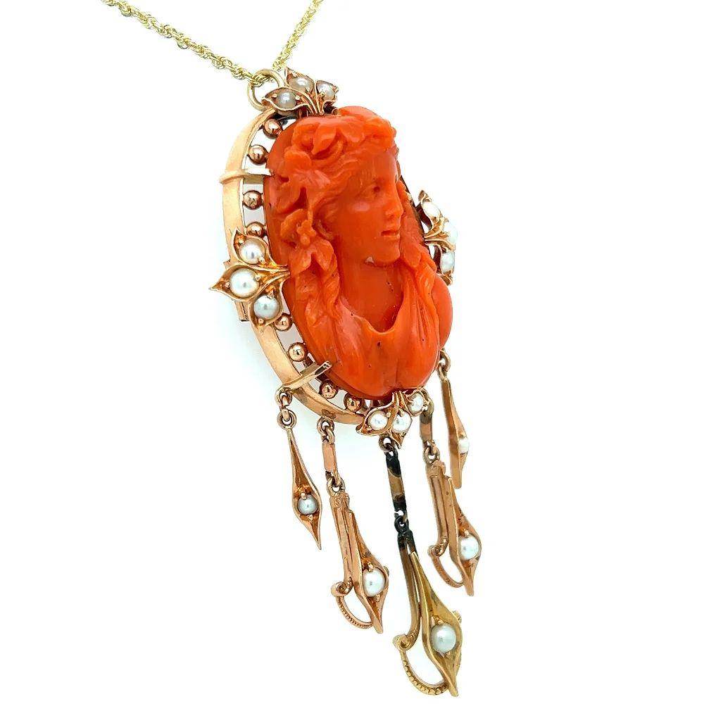 Simply Beautiful! Hand carved Large Coral Cameo and Seed Pearl Brooch Pendant Necklace. Featuring a Hand carved Coral Female Portrait, accented by Seed Pearls and Pearl set dangling drops. Measuring approx. 75mm. Hand crafted 14K Rose Gold mounting.