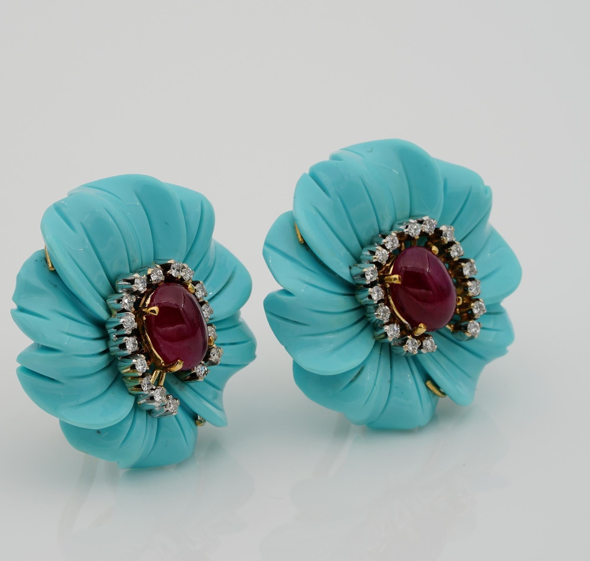 Inspired by Nature

Charming pair of Vintage earrings 1960 ca
Made by Carved Turquoise of large size modelled as beautiful Flowers with heart of Ruby and Diamond surround
They are 26 mm x 27 mm in size – mounted in 18 KT solid gold
Centre is made of