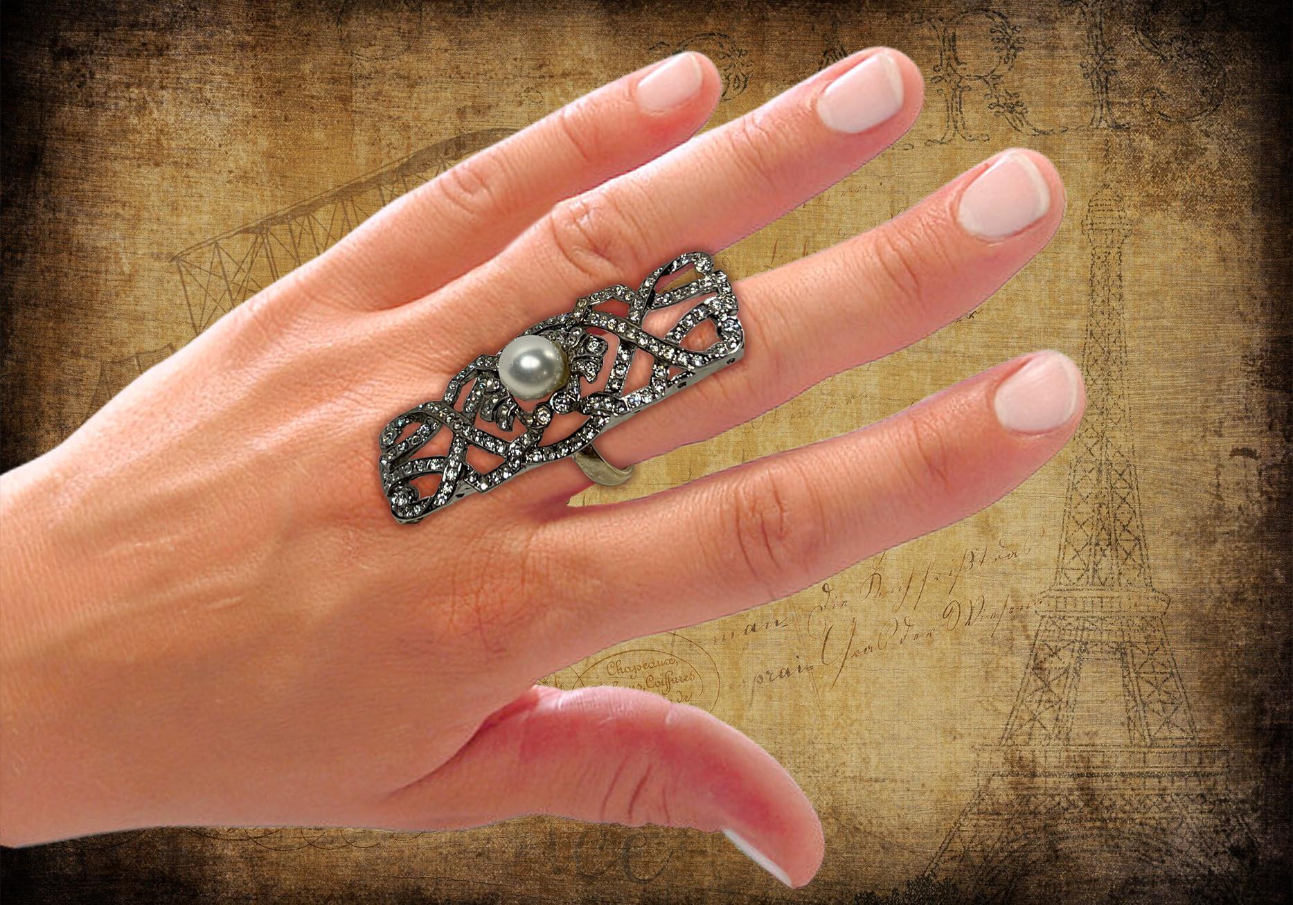 Vintage Large Cocktail Diamond Pearl Sterling Costume Jewelry Dinner Ring

Our exclusive jewelry is unique and no other similar of such quality and elegance may found elsewhere on 1stibs.
A fabulous vintage white CZ and faux pearl set in rhodium