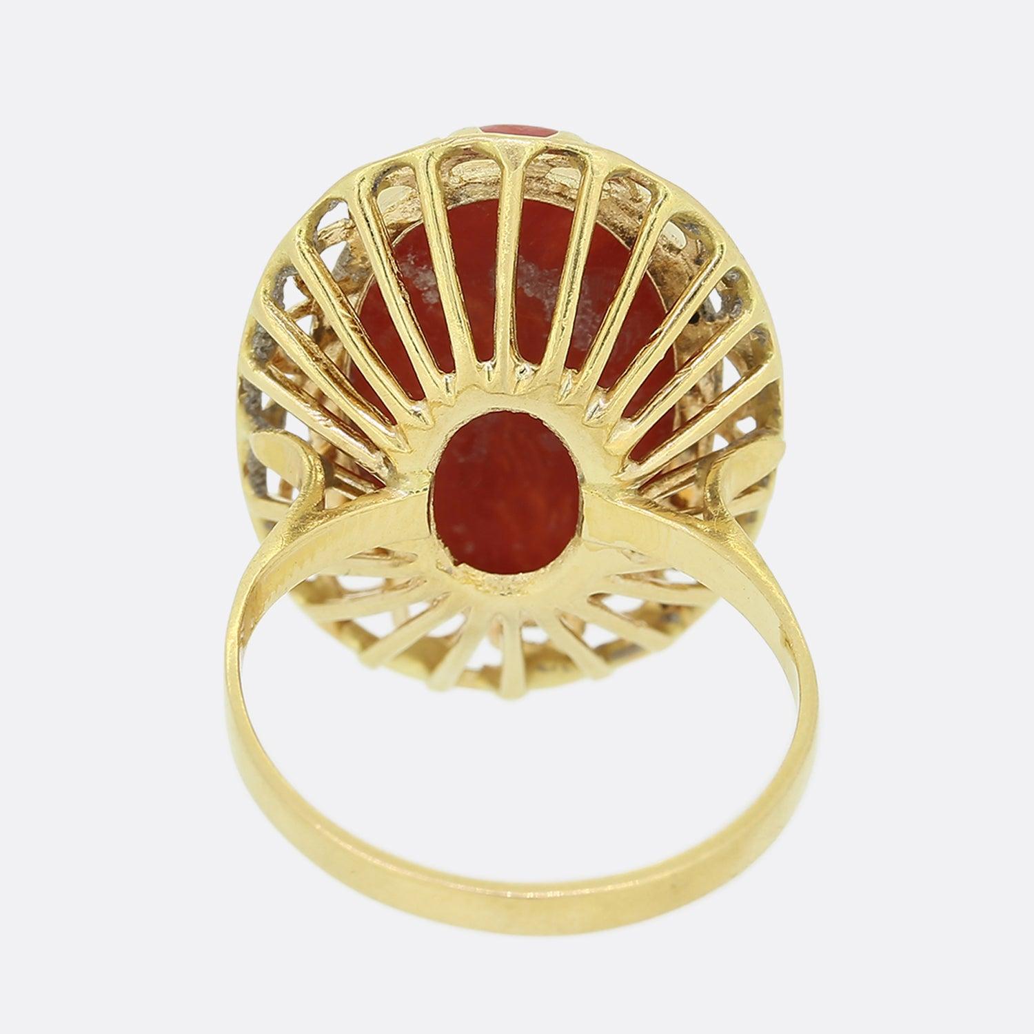 This is a vintage 18ct yellow gold coral cocktail ring. The central cabochon coral stone is a beautiful peach hue held in a bezel style mount.

Condition: Used (Very Good)
Weight: 6.9 grams
Size: N
Face Dimensions: 24mm x 18mm
Coral Dimensions: