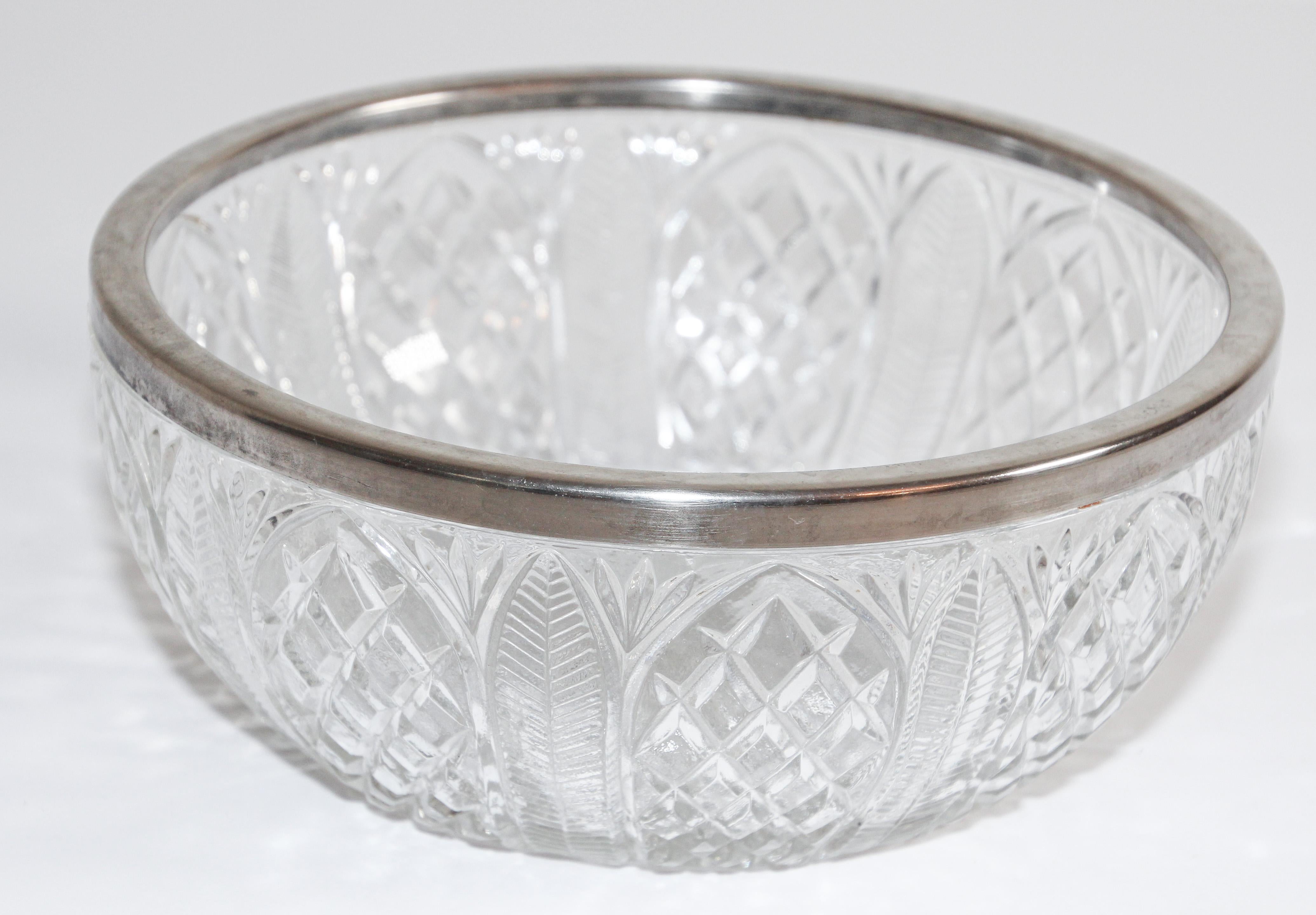 Vintage large heavy crystal bowl with silver plated rim produced by Raimond, England.
Incised on the rim “Made in England” (see pictures, the pattern features a beautiful cutout starburst pattern. The bottom of the bowl is gorgeous and offers the